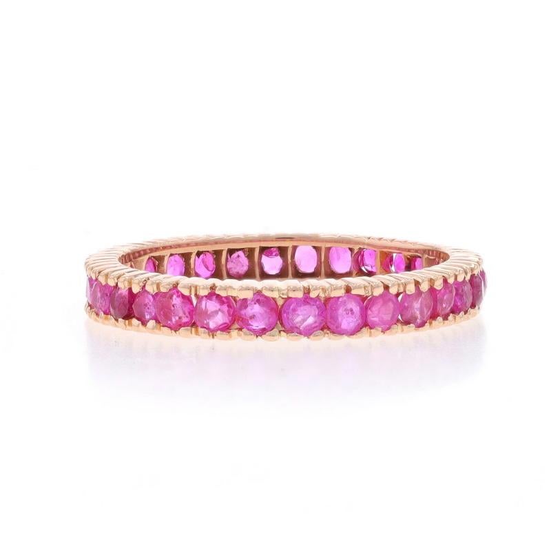 Size: 7

Metal Content: 14k Rose Gold

Stone Information

Natural Rubies
Treatment: Heating
Carat(s): 1.50ctw
Cut: Round
Color: Pinkish Red

Total Carats: 1.50ctw

Style: Infinity Band

Measurements

Face Height (north to south): 1/8