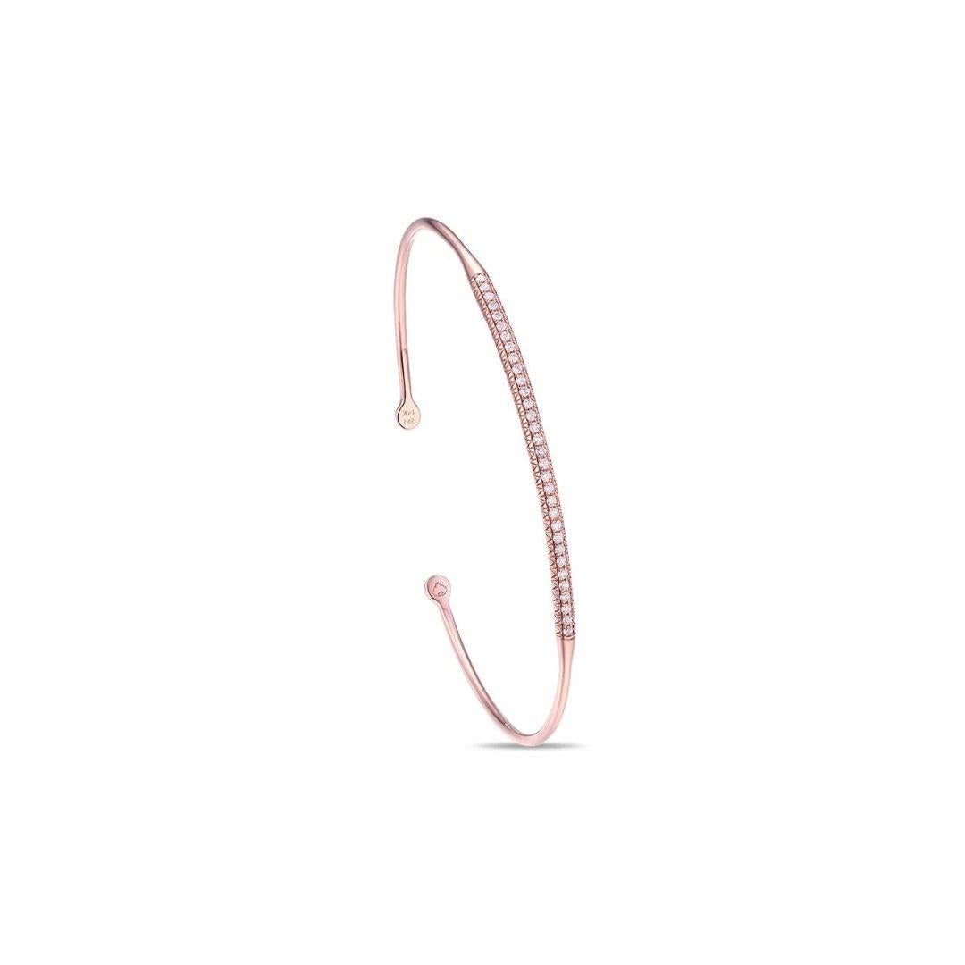 Elegant 14k rose gold bangle with pave set round brilliant diamonds. Perfect to wear on its own or stacked with other bangles. Diamonds are H-I color, SI clarity, total carat weight 0.65 ctw. One size fits most.