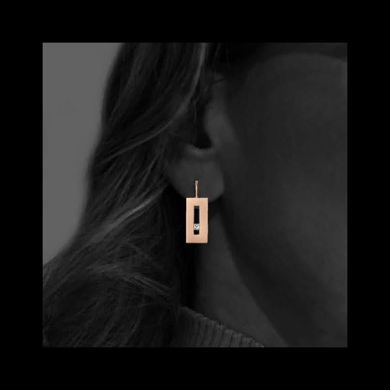 These Diamond in Rose Gold Suspended Rectangle hook earrings from our Suspension Collection echo the idea of princess cut diamonds set off center. Shown in rose gold with approximately .20 pts diamond total weight in a matte finish. Available in