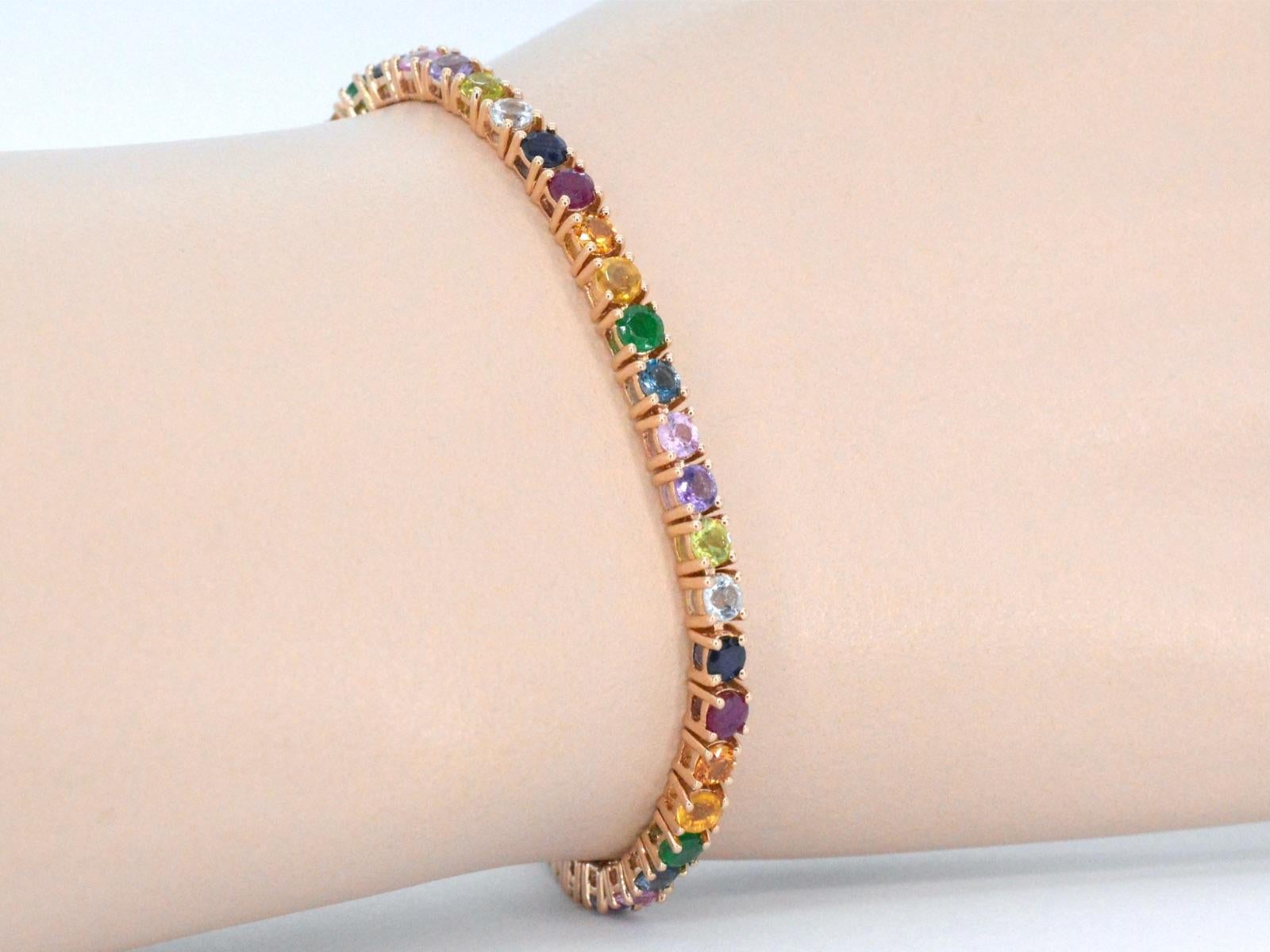 Gemstones: Rainbow
Weight: 7.50 carats
Colour: multicolour
Clarity: With natural inclusions
Cut: Brilliant cut
Quality: Very good

Jewel: Bracelet
Weight: 10 gram
Hallmark: 14 karat 
Length: 18 cm
Condition: New

Retail value: € 

A rose gold tennis