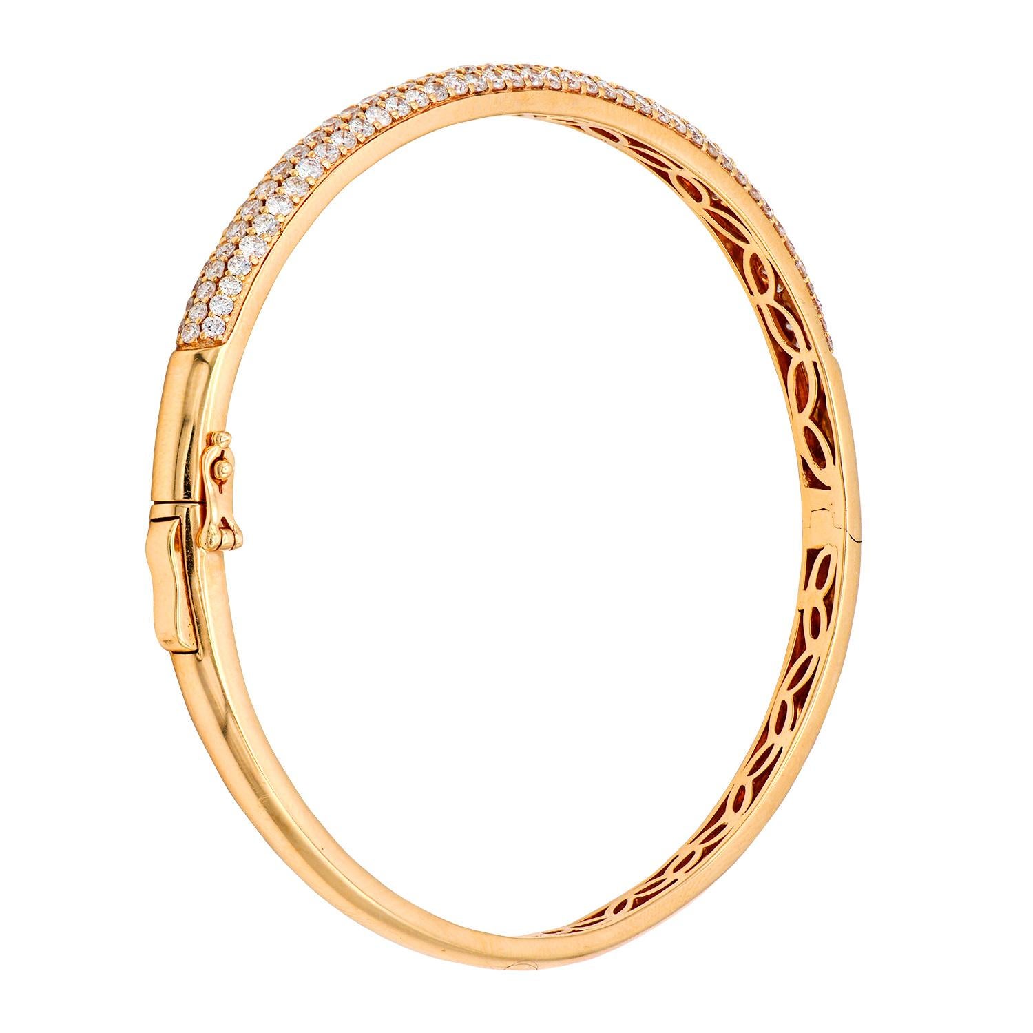 Fashion and glam are at the forefront with this exquisite diamond bangle. This 18 karat rose gold bracelet is made from 12.1 grams of gold. The top is adorned with three rows of VS2, G color diamonds made out of 54 diamonds totaling 1.91 carats,