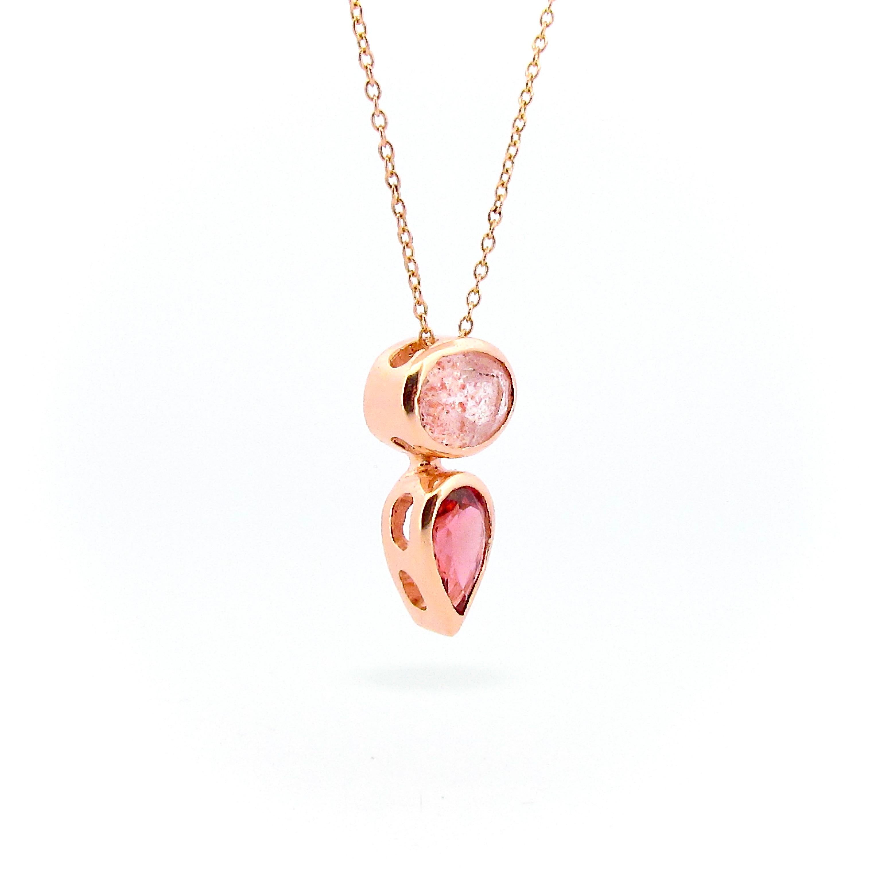 This 9ct solid Gold Balance pendant is set with an usual Oval faceted Strawberry Quartz, and has a beautiful Pink Pear shaped Tourmaline dropping off it, it slides beautifully on a solid 9ct rose gold 50cm/20inch delicate cable chain.   The dark and