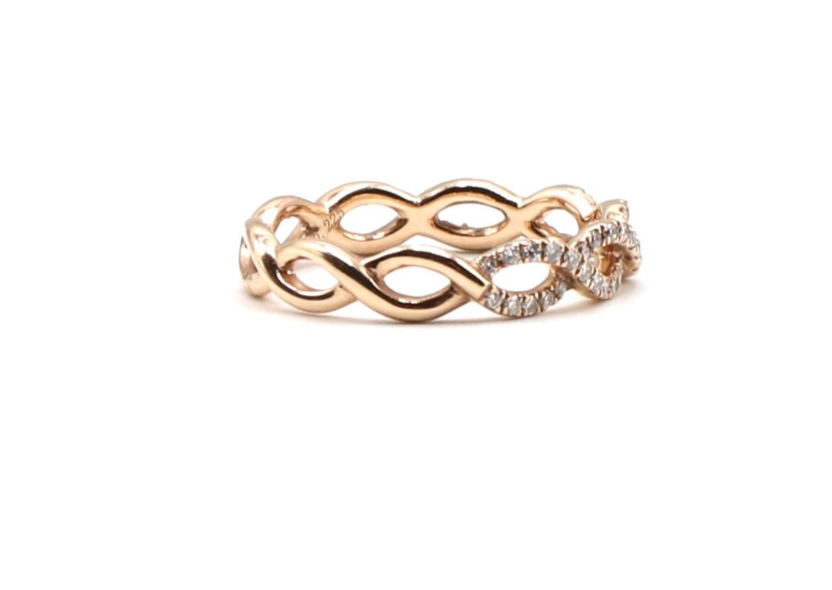 14K Rose Gold Braided Natural Diamond 0.225 CTW Wedding Band Ring Size 5.5

Metal: 14K Rose 585
Weight: 1.86 grams
54 round natural diamonds measuring approx. 0.225 ctw G-H color VS clarity
Width: approx. 4mm
Stamped: 