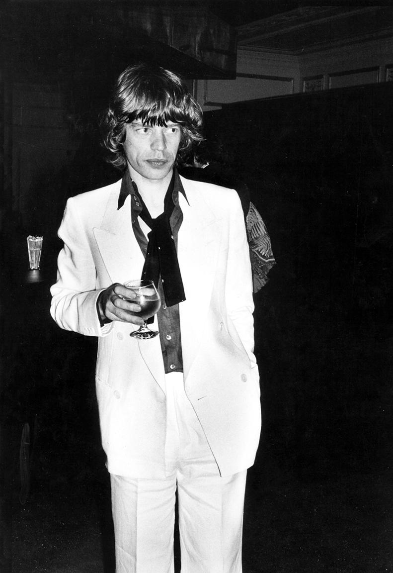 Rose Hartman Black and White Photograph - Mick Jagger at Bianca Jagger's 30th birthday party at Studio 54
