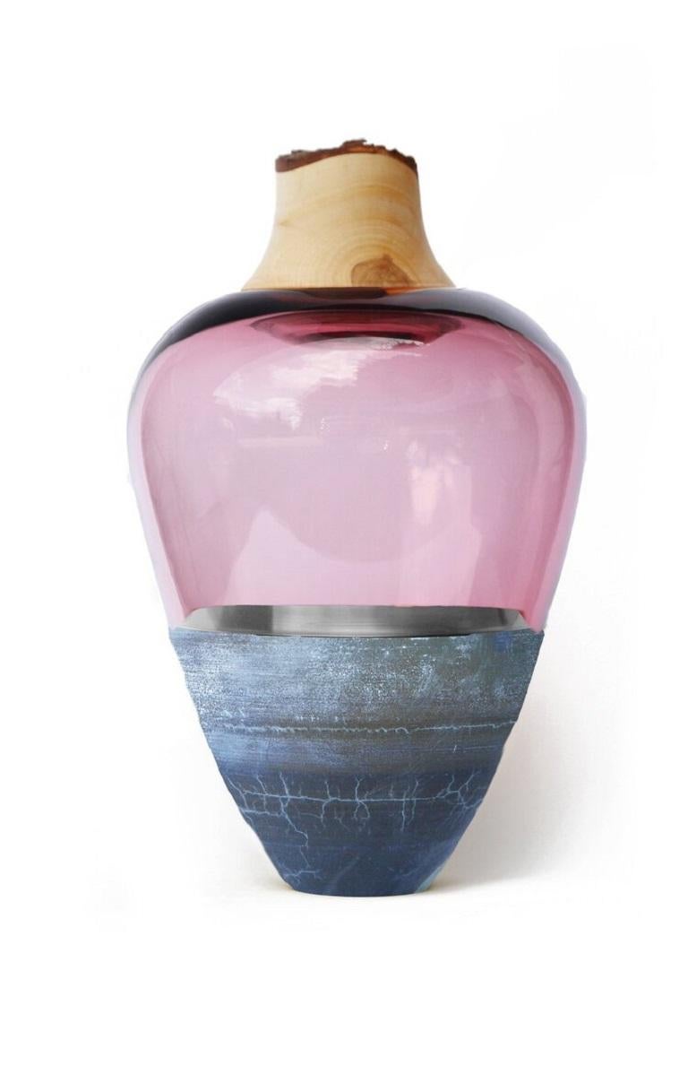Rose India Vessel I, Pia Wüstenberg
Dimensions: D 20 x H 38
Materials: glass, wood, metal

Handmade in Europe, by individual craftsmen: handblown glass (Czech Republic), hand spun metal, (England), hand turned wood (Finland). The materials then