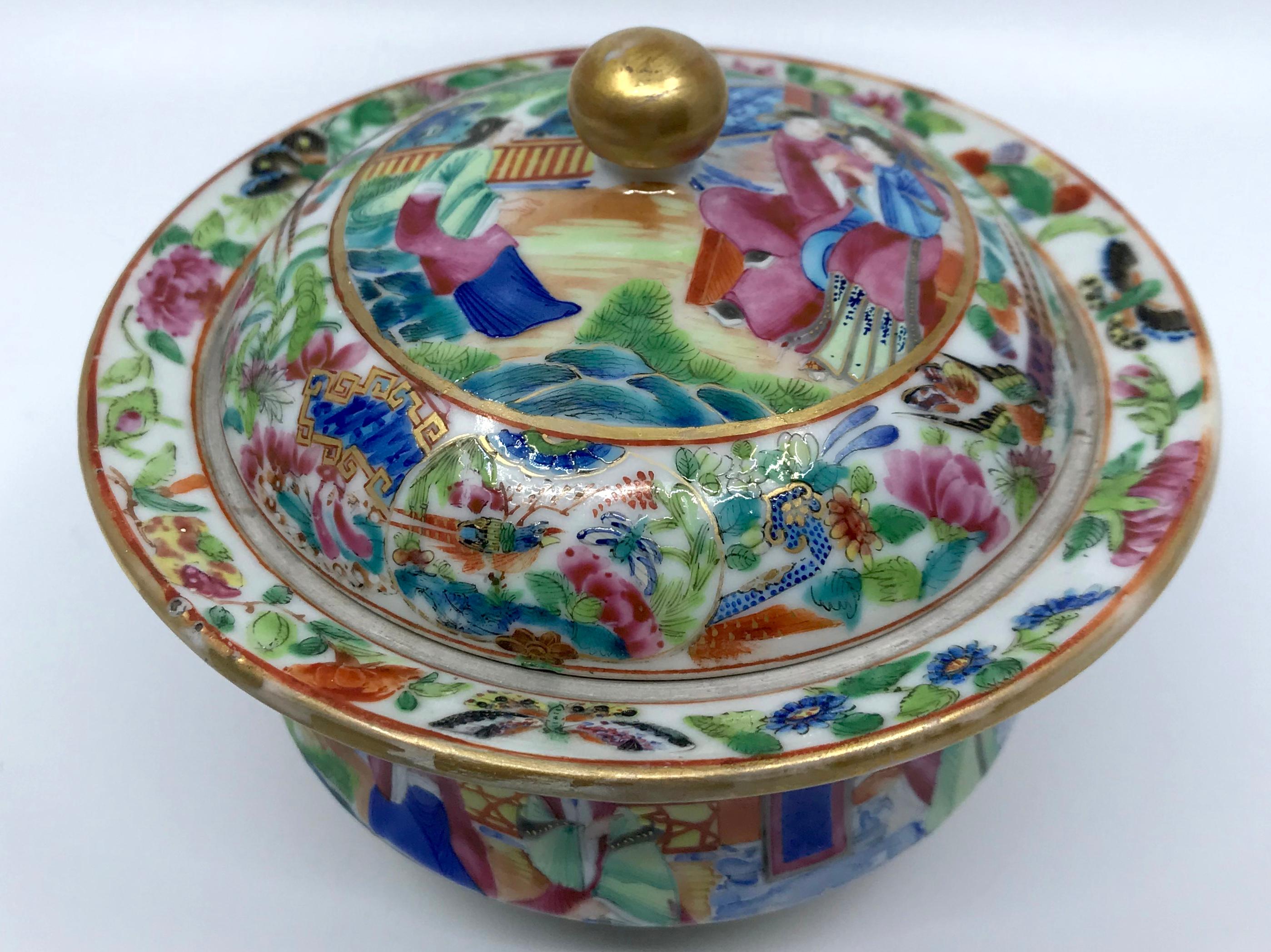 Rose Mandarin Chinese porcelain lidded bowl. Vibrantly hued Chinese Export covered footed bowl in pinks and blues and greens with gilt ball finial to the lid. China, mid 19th century. 
Dimensions: 5.5