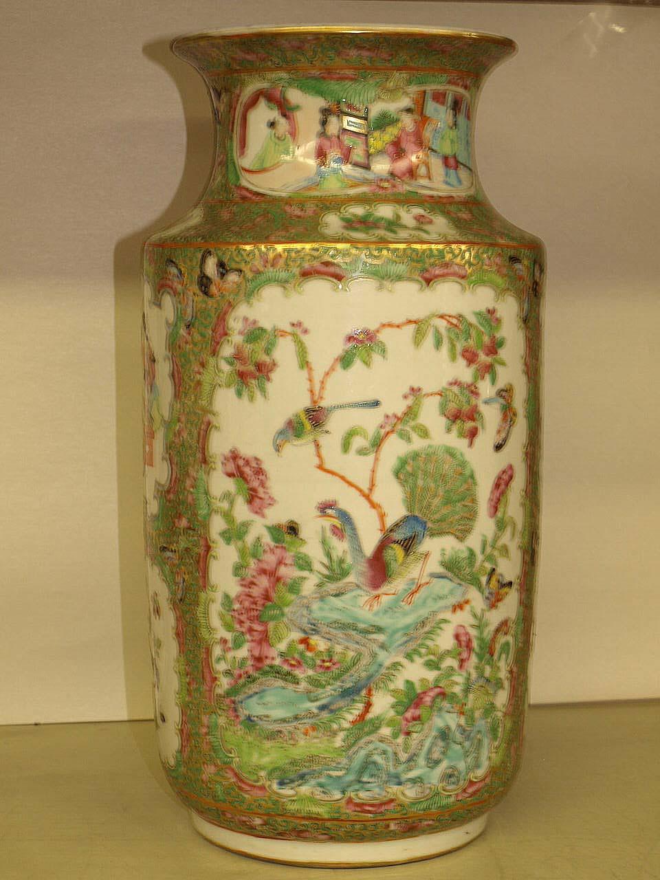 Rose mandarin vase, with a two large polychrome panels, one with birds and flowers, the other is an exterior scene depicting a multitude of female figures. These panels are flanked by two smaller panels also depicting birds, flowers and figures, in