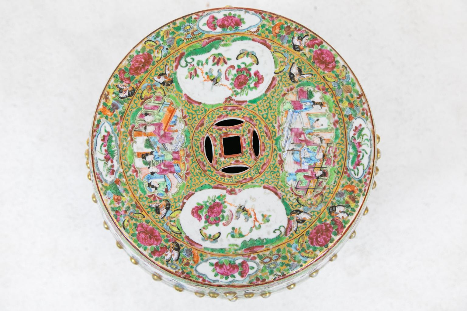 Rose Mandarin garden seat, has mandarin figures painted over all with birds, butterflies, and flowers in the top four cartouches. The middle area is painted with two large central panels featuring Mandarin figures in a palace. Ladies are depicted