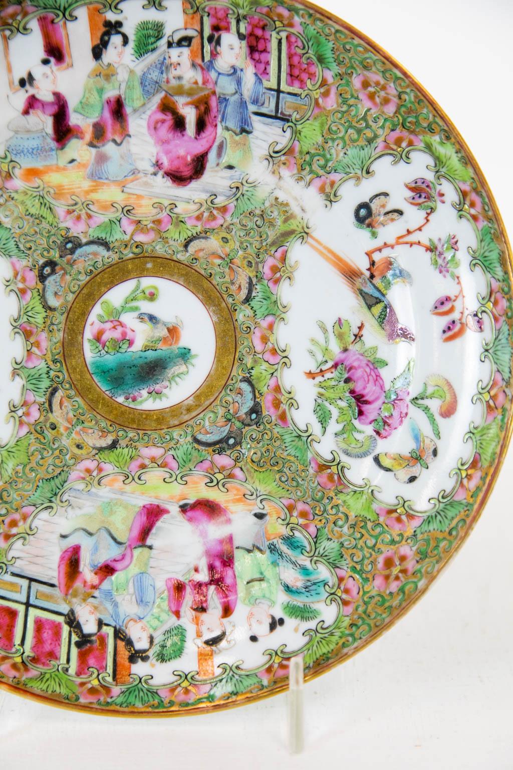 This plate has four cartouches depicting birds, butterflies, and Mandarin court scenes. It is in mint condition.