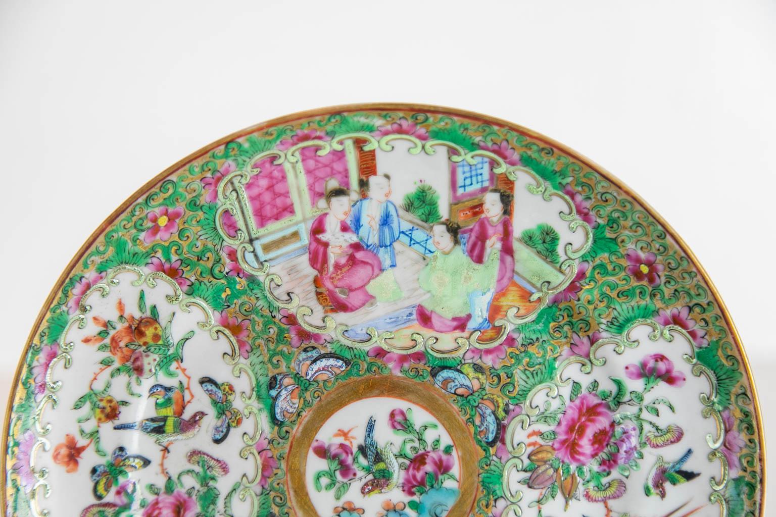 This Chinese plate is in excellent condition. There are four cartouches depicting Mandarin figures, birds, butterflies, fruit, and flowers.