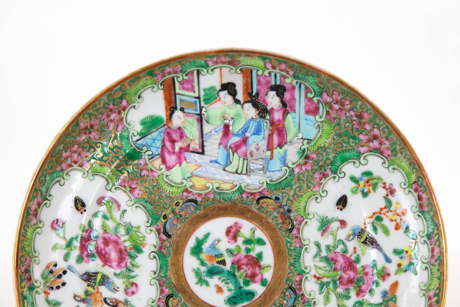 This plate has four cartouches depicting Mandarin court scenes, birds, flowers, fruit, and butterflies. It is in mint condition.