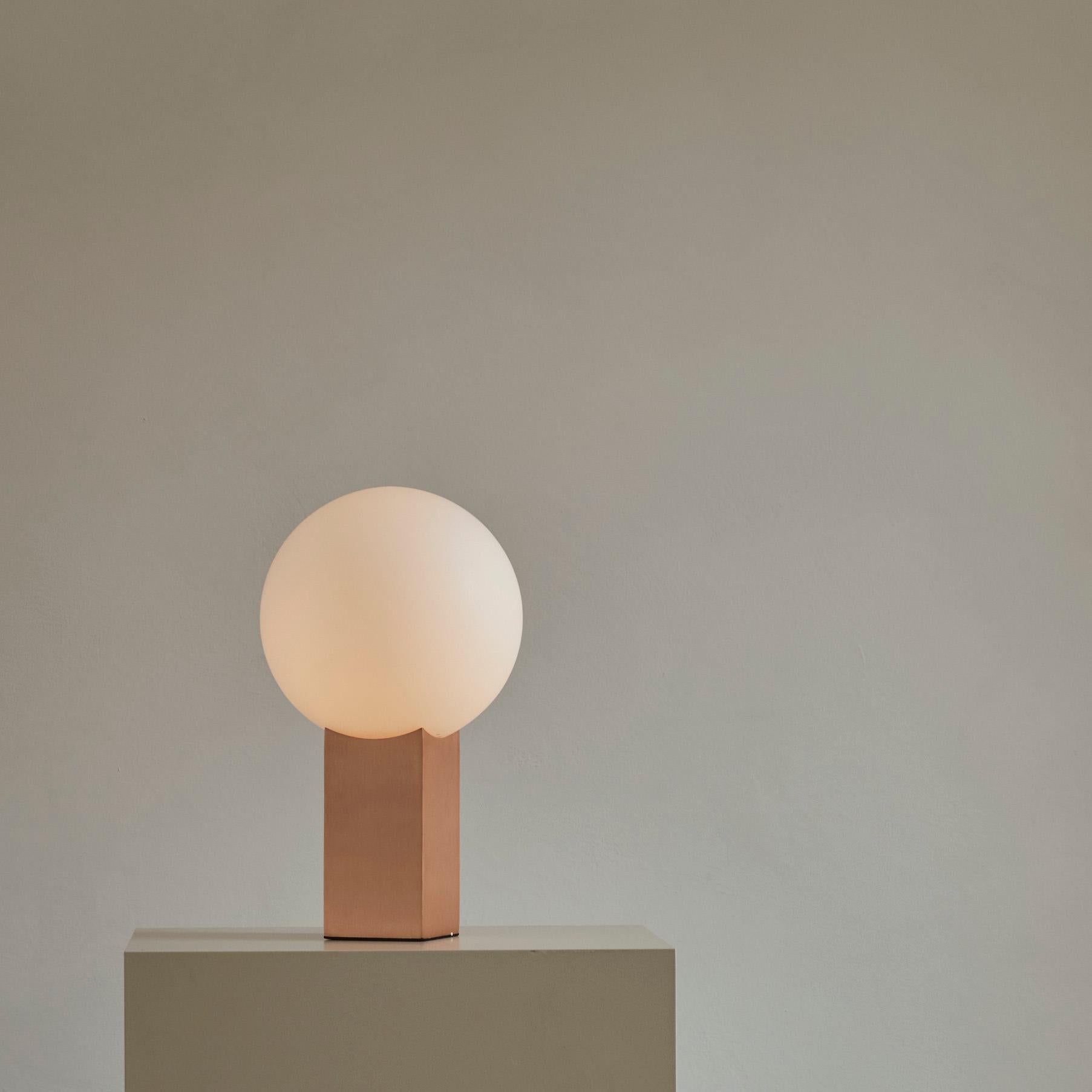 Rose metal hoop table lamp by 101 Copenhagen
Designed by Nicolaj Nøddesbo & Tommy Hyldahl
Dimensions: L 20 x W 20 x H 34 cm
Cable length: 200 cm
This product is not wired for USA
Materials: Metal: Plated metal / rose metal
Opal glass / White
Cable: