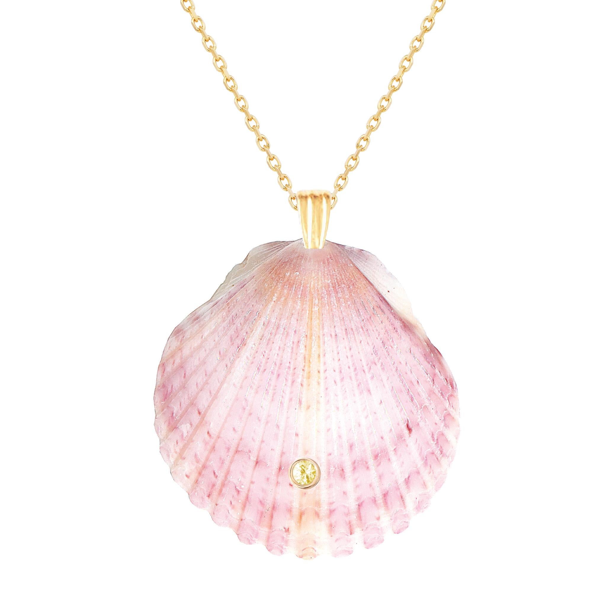 Natural shell pendant with solid 14k gold findings and natural yellow sapphire gemstone. Wear this pendant alone or layer it with other gold chains for a beautiful layered effect.  

Order includes one shell pendant, exactly as depicted in primary