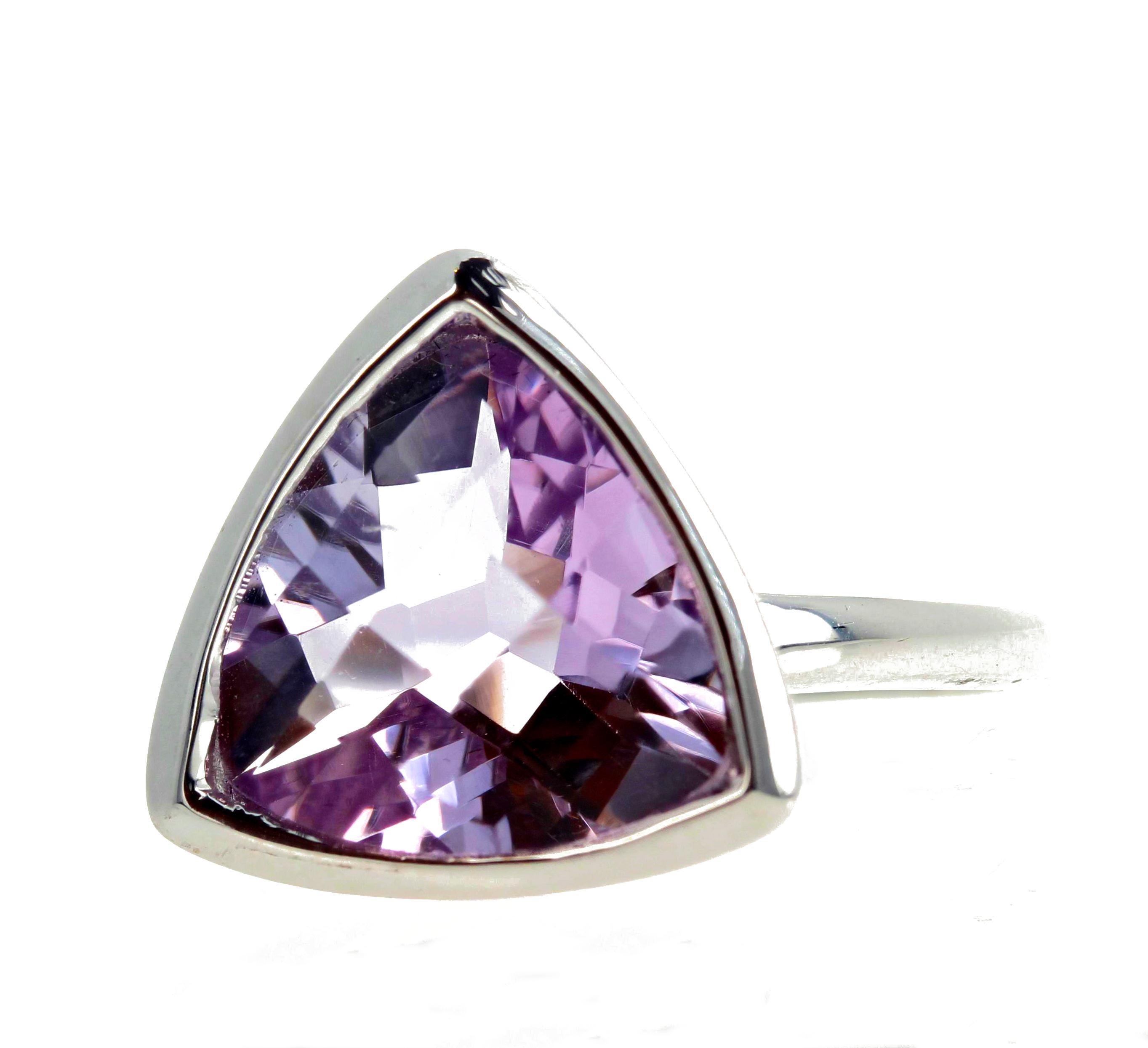 This beautiful checkerboard gem cut 7 carat pinky lilac Amethyst - Rose of France - is set in a Rhodium plated sterling silver ring size 8 3/4 (sizable for free).  It is unusual and unique the way it is set up high so it glitters beautifully and