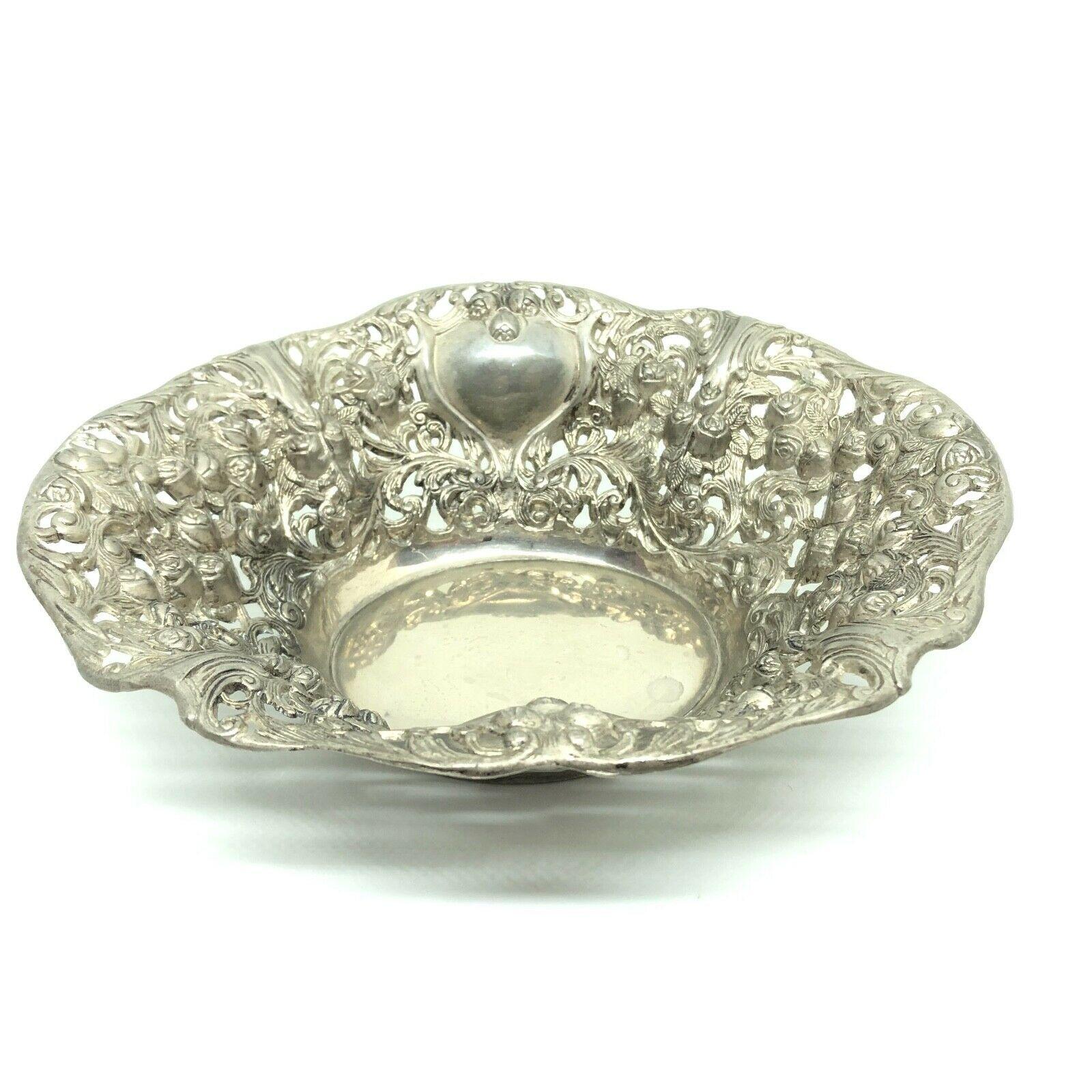 A beautiful tea cookies or small fruit bowl basket. It is in a nice 'Rose and Leaf' design. Made of silver plated metal, it will make a nice addition to any table.
  