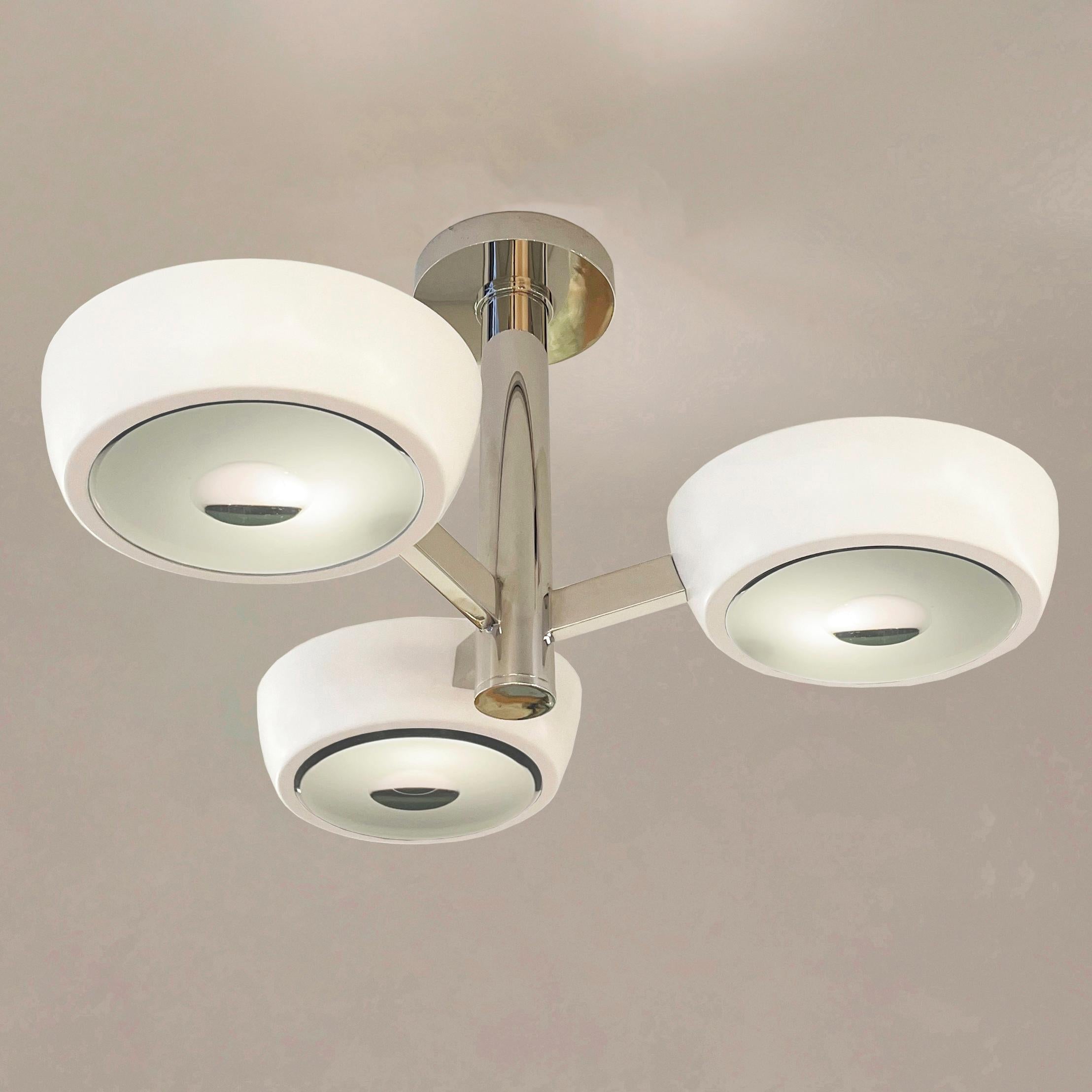 The Rose Piccolo ceiling light is the smallest member of the Rose family, distinguished by its branching frame ending with clean and modern shades. With the option to customize the color of the shades, the finish of the metal and the type of glass,