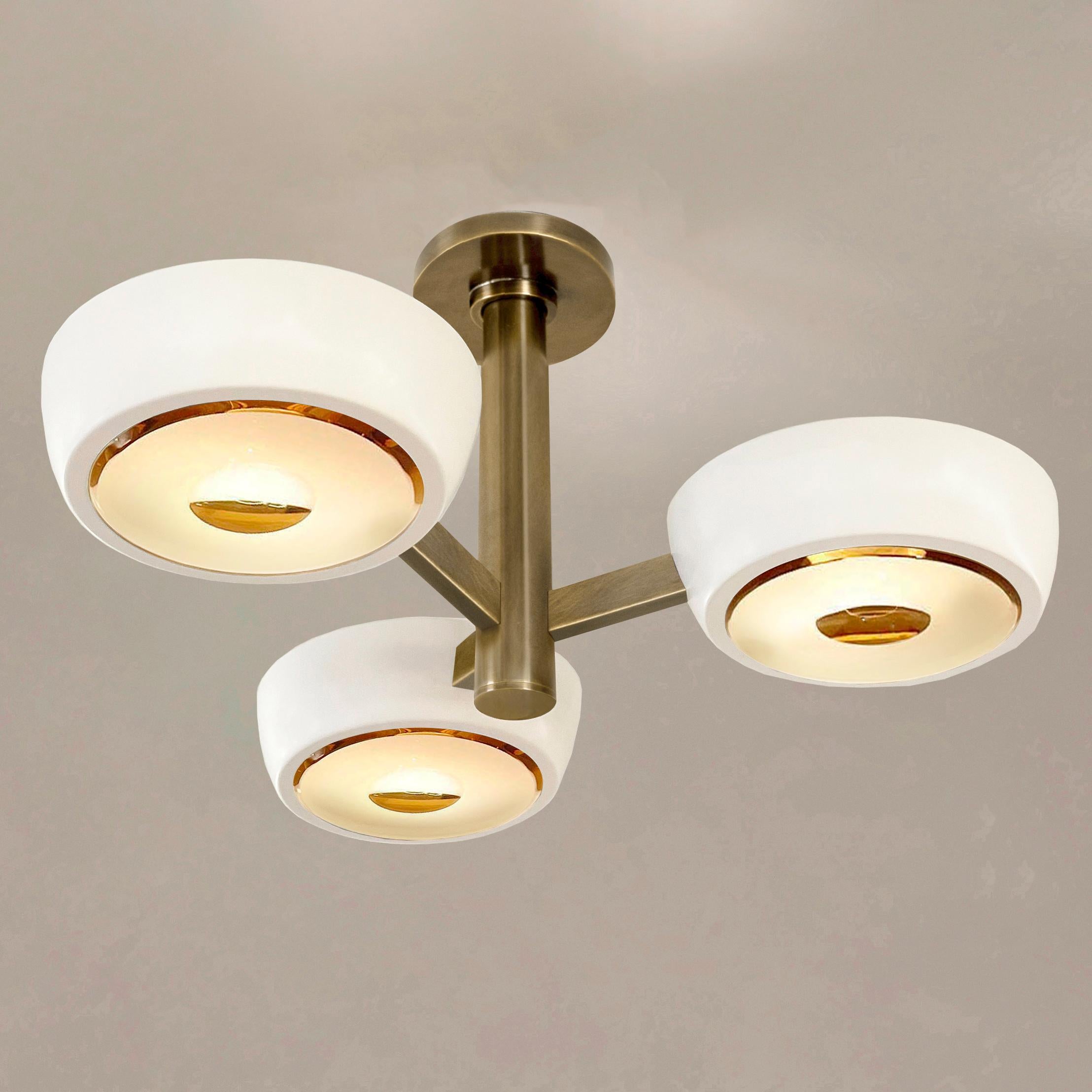 The Rose Piccolo ceiling light is the smallest member of the Rose family, distinguished by its branching frame ending with clean and modern shades. With the option to customize the color of the shades, the finish of the metal and the type of glass,