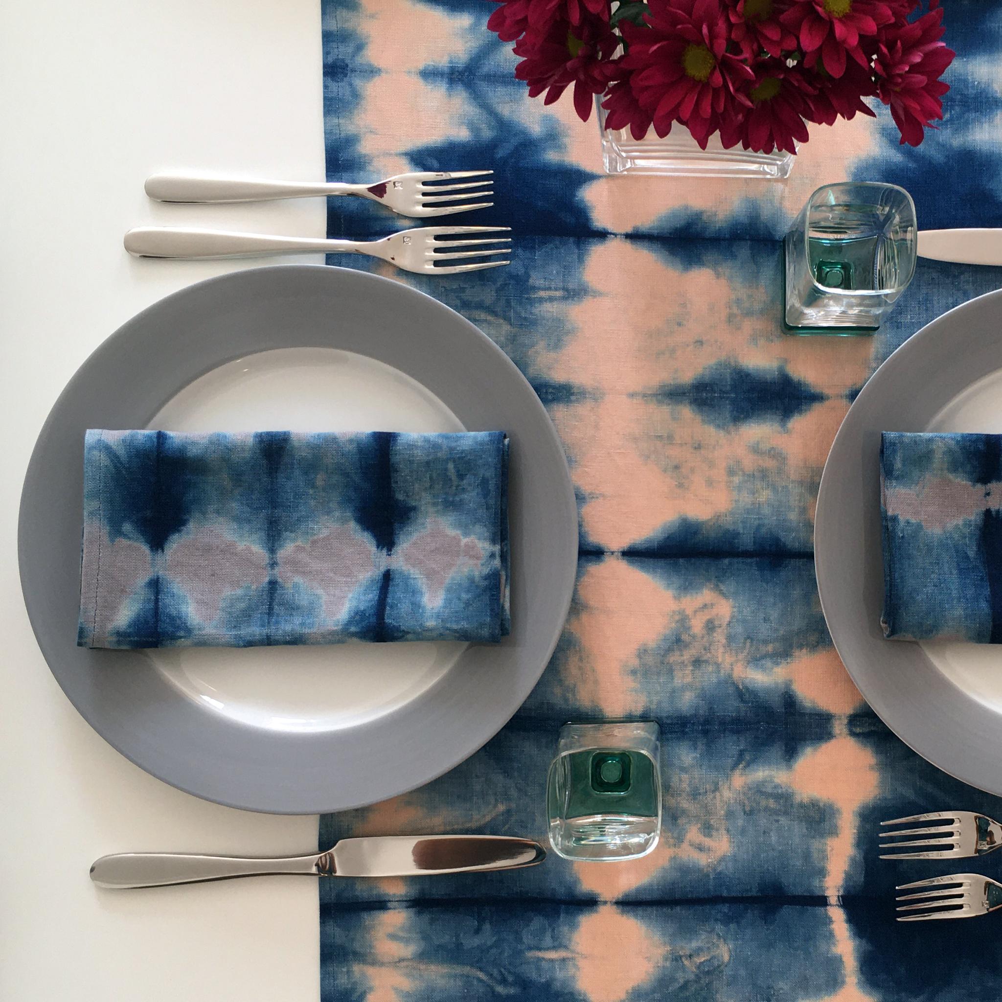 Rose linen table runner dyed with indigo in Pleat pattern. Hand-dyed and sewn in New York City. Runner measures approximately 18 x 72 inches. Each linen runner is hand dyed and one of a kind. 

Each linen panel is cut and folded by hand, in the