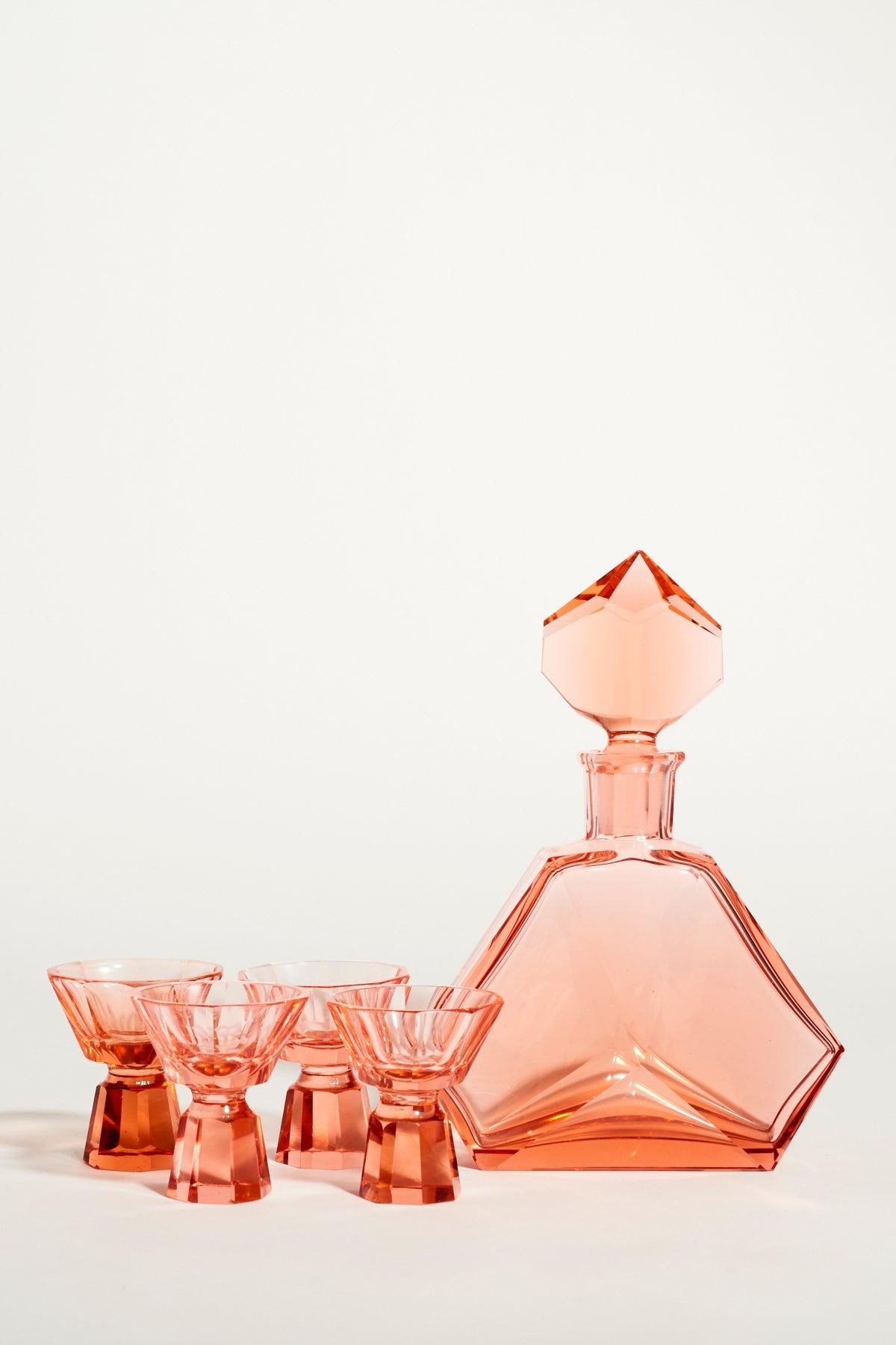 Gorgeous peach pink faceted decanter and glasses.
 Decanter: 8.5