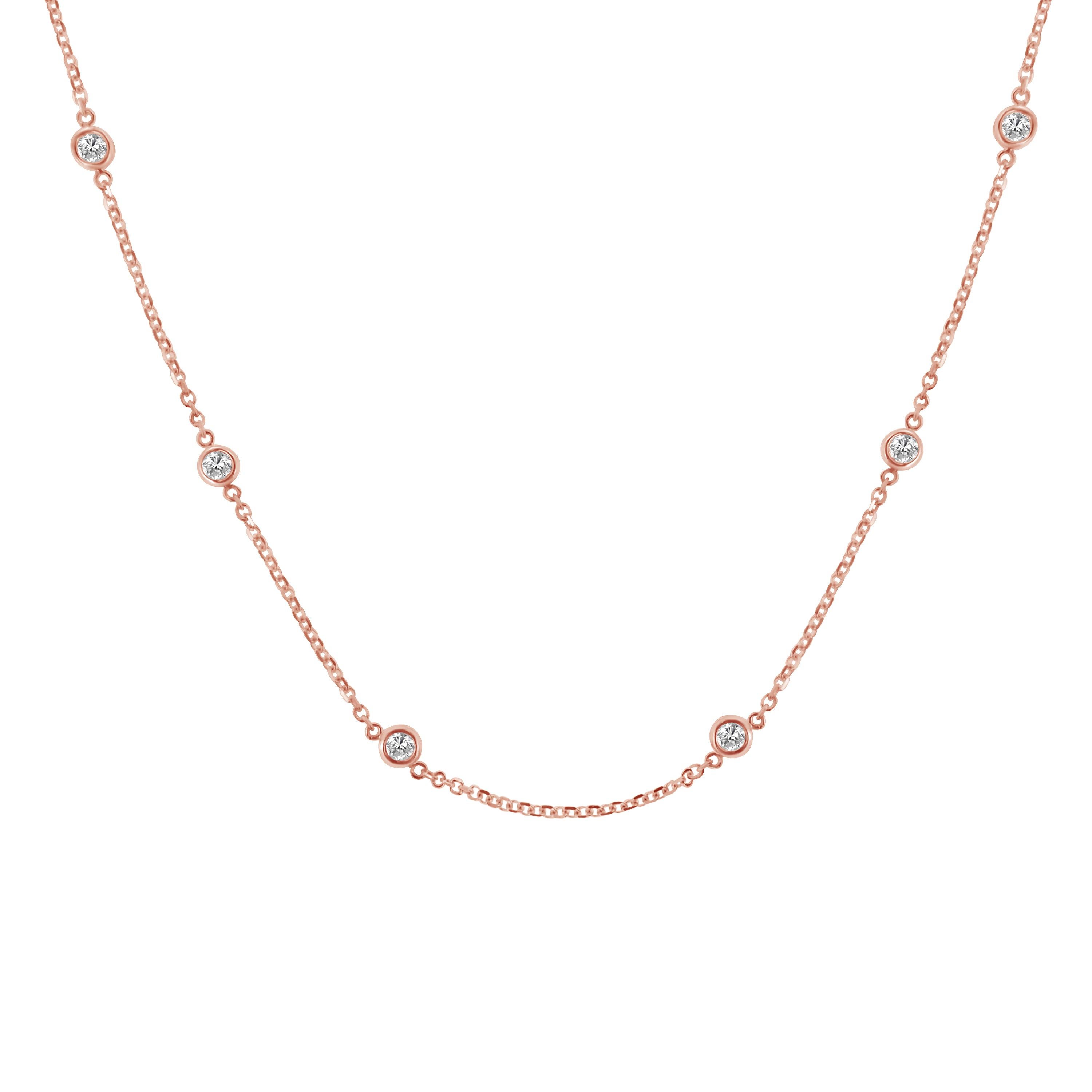 A great complement to both dressy and casual wear, this sterling silver, diamond station necklace, in your choice of white, yellow, and rose colors is extremely trendy, classy, and fashionable. Twelve brilliant cut round diamonds, weighing 1 carat