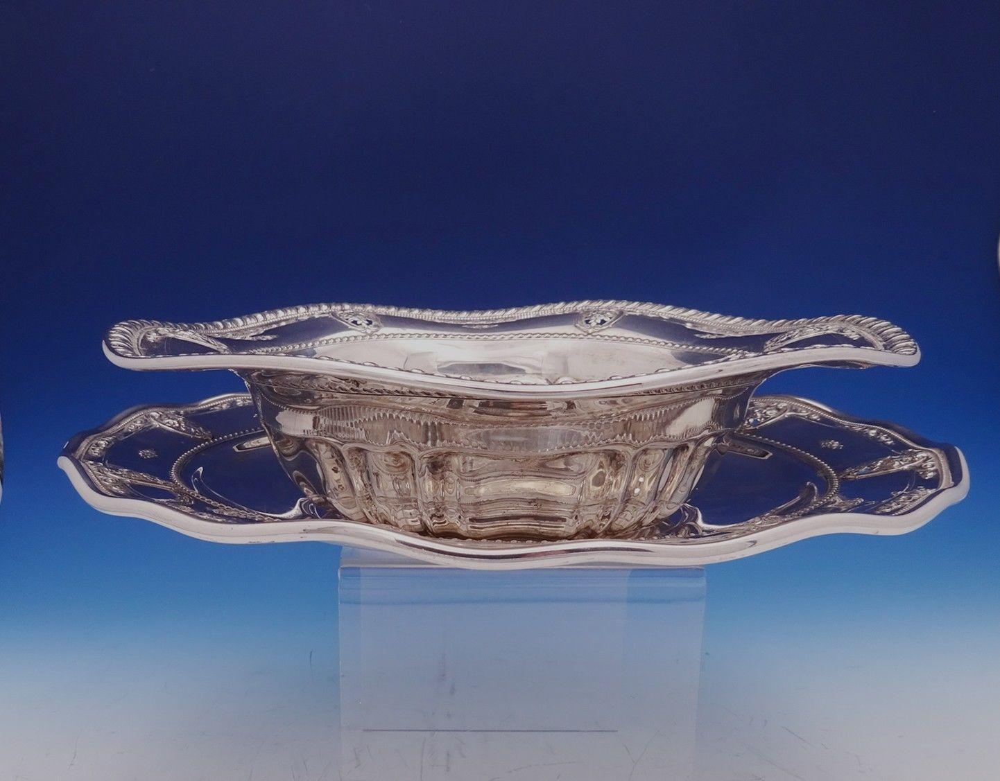 Wonderful rose point by Wallace sterling silver serving bowl with underplate. Both pieces have rippled edges.
The bowl is marked #4611-9, measures 2 3/4 x 11 1/2 in diameter, and weighs 17.2 troy ounces. The plate is marked #4600-9, measures 1 1/8 x