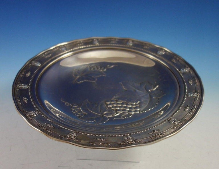 Lovely rose point by Wallace sterling silver round serving tray / platter marked #4455-9. This piece is rare with repoussed and engraved grapes and leaves. The border is pierced with Rose Point pattern and rippled. This tray was made to complement a