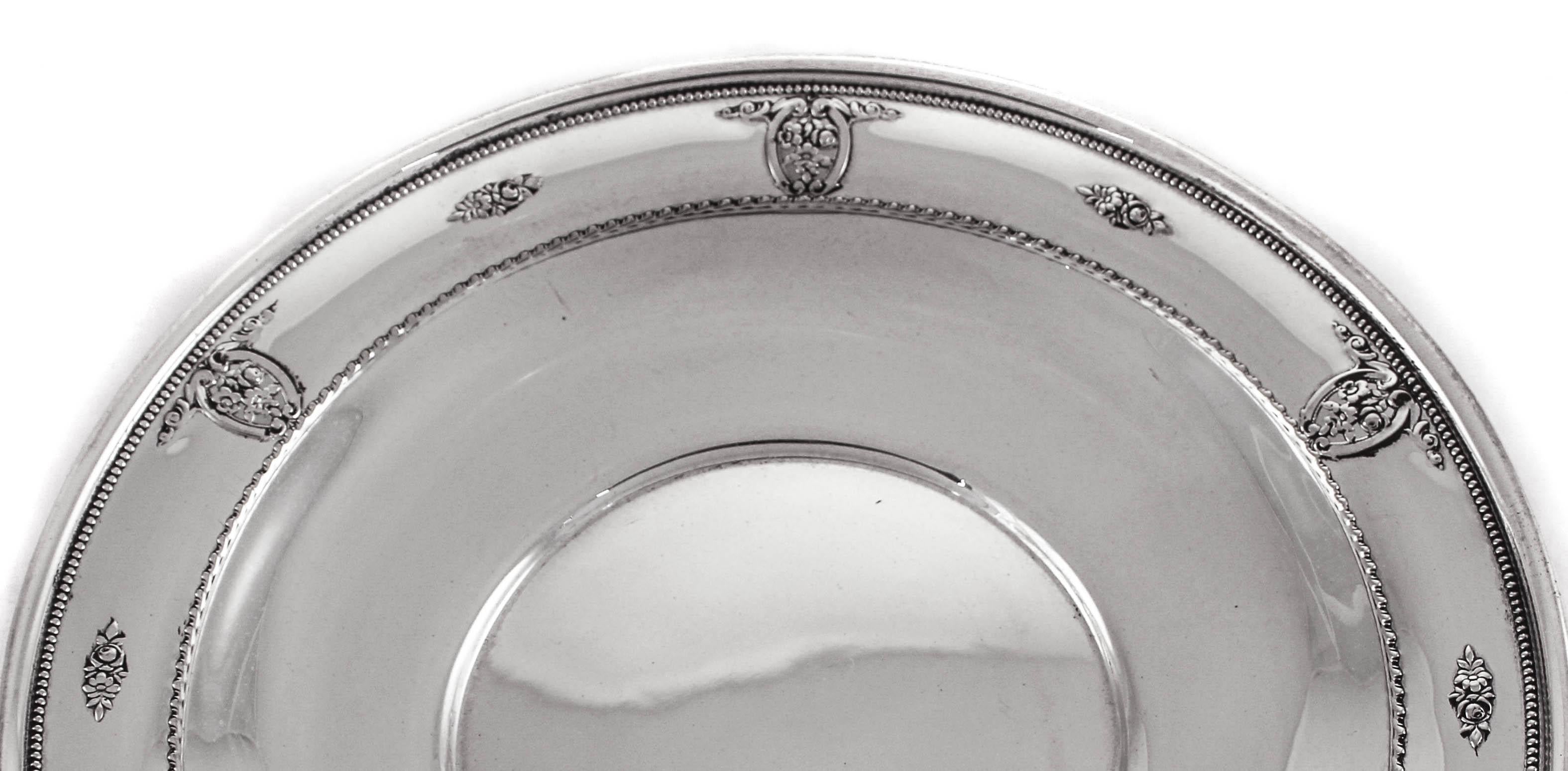 This dainty sterling plate is the ideal size for casual entertaining. It can be used for pastries, finger-food or even sweets. It has a rose motif around the border with cutout work intermittently.