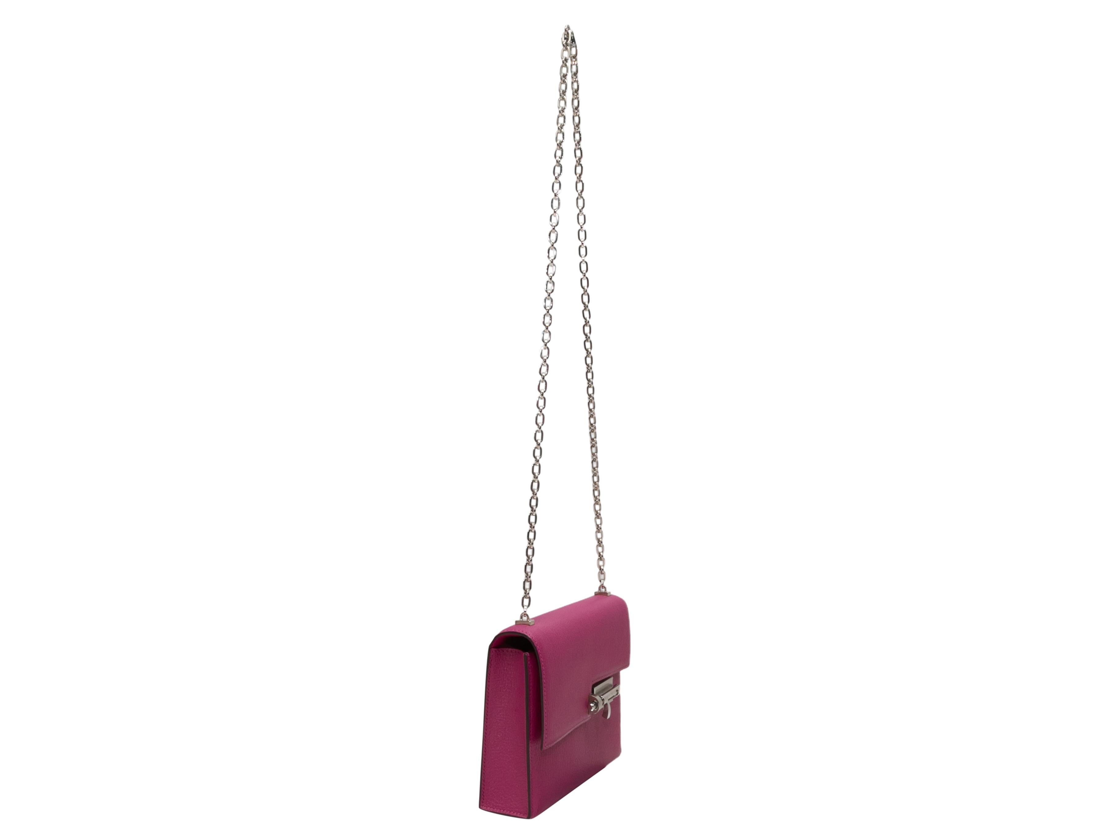 Rose Pourpre Hermes Mini Verrou Crossbody Bag. The Mini Verrou Crossbody Bag features a leather body, silver-tone hardware, a single chain-link shoulder strap, metal feet at bottom, and a front flap clasp closure. 6.75
