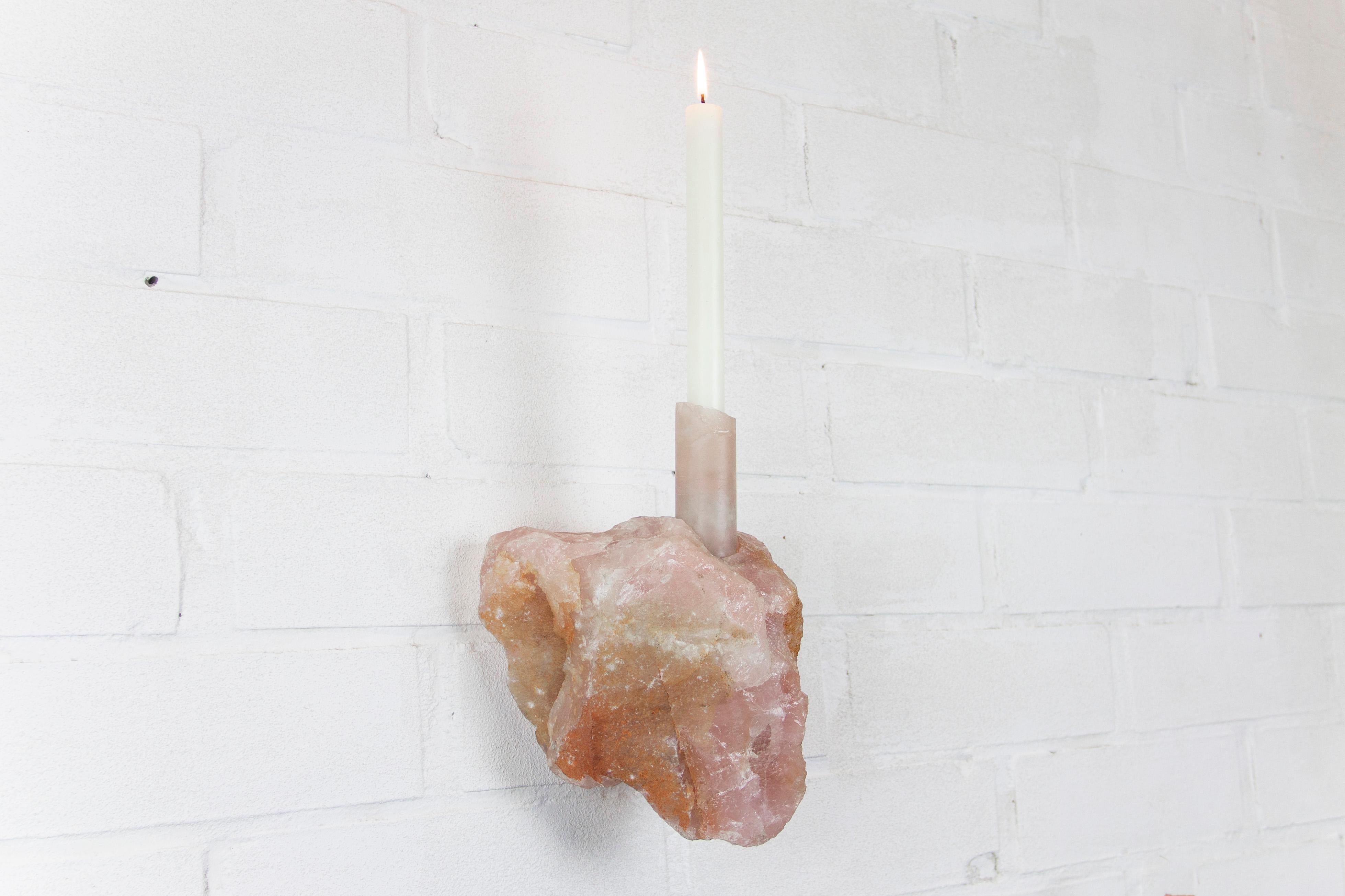 Rose Quartz Abra Candelabra by Studio DO
Dimensions: D 16 x W 14 x H 25.5 cm
Materials: Rose quartz, aluminum.
5.4 kg.

Stone and fire are connected in an ageless bond. A sparkle created by clashing two stones with each other has been igniting fire