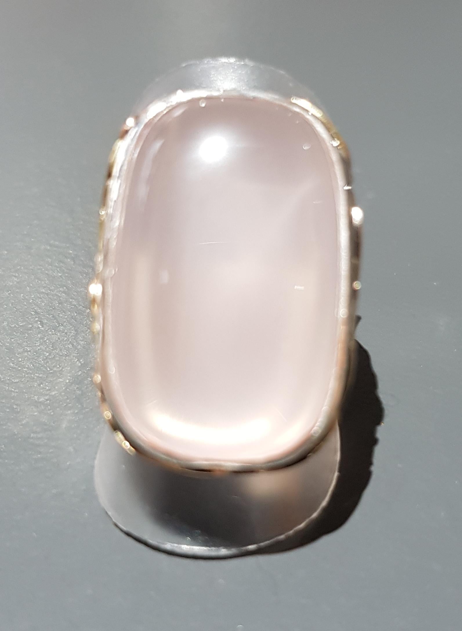 Large Rose Quartz ring hand made in Silver with lots of solid gold detail. with Diamonds dotted around the design 
ring size P

AVAILABLE