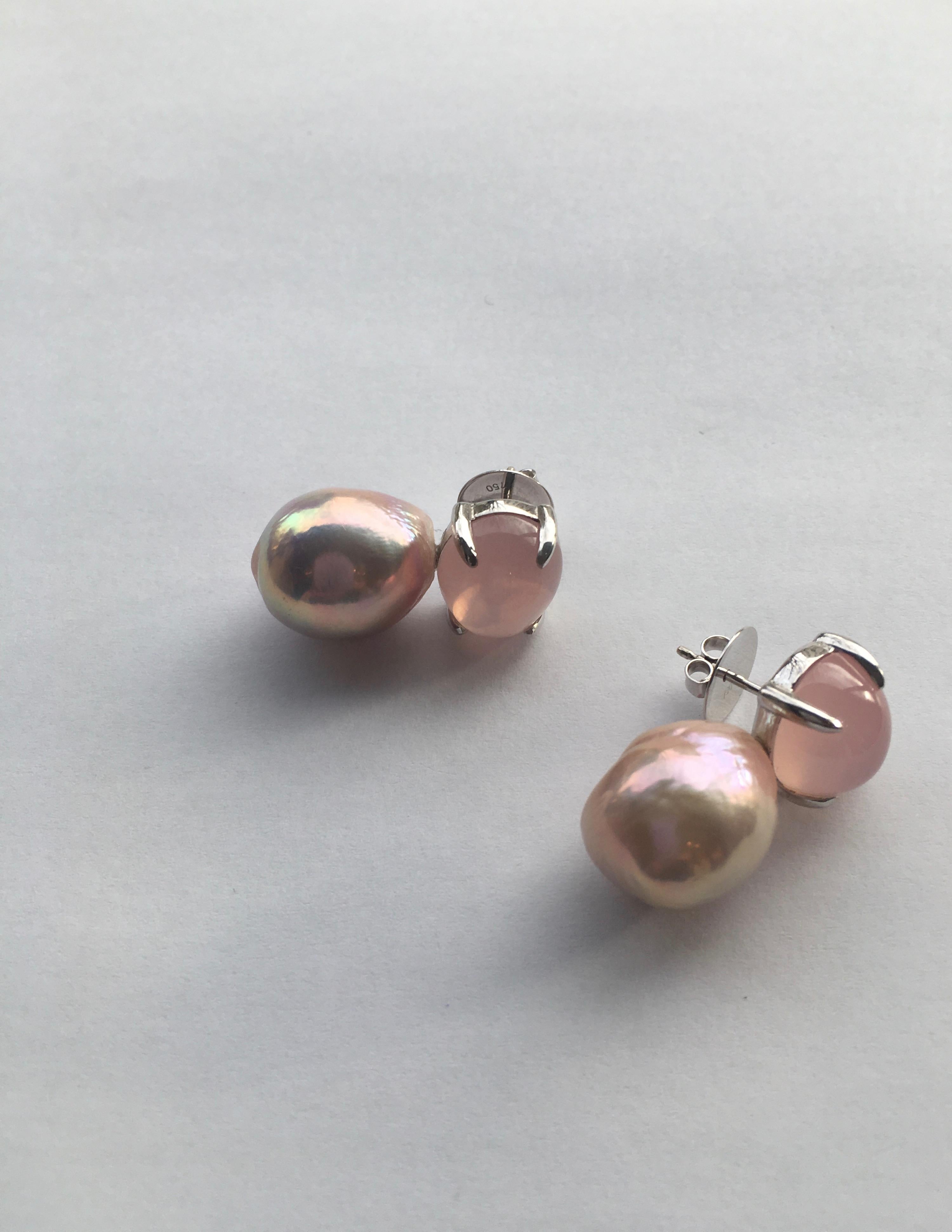 A pair of earrings with rose quartz cabochons and beautiful baroque pink freshwater pearls.  Set in 18 Karat white gold these simple yet distinct earrings are for the sophisticated pearl lover.  Adding a touch of freshness with the pink tones they