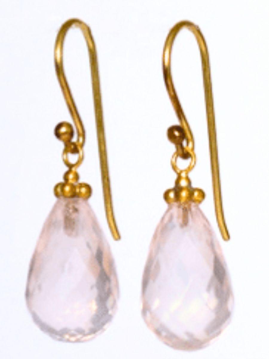 The exceptional pair of briolette cut rose quartz drops in these 18k Royal yellow recycled gold dangle earrings give off an ethereal quality - they seem to glow from within. The delicate pastel pink hue of the rose quartz contrast with the cool