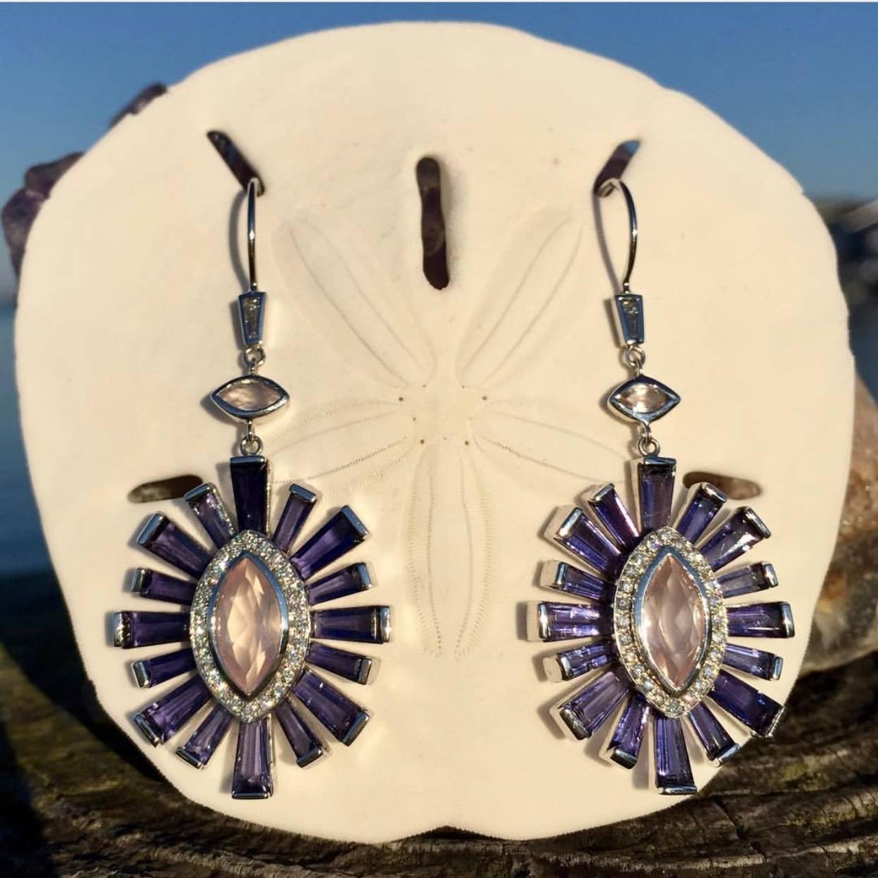 Rose quartz marquise framed in a halo of diamonds and radiating with iolite tapered baguettes.  Set in 18k white gold.  

Each piece of jewelry is handmade to order for you.  Production time is 4-6 weeks.  Customization of gold color, stones and