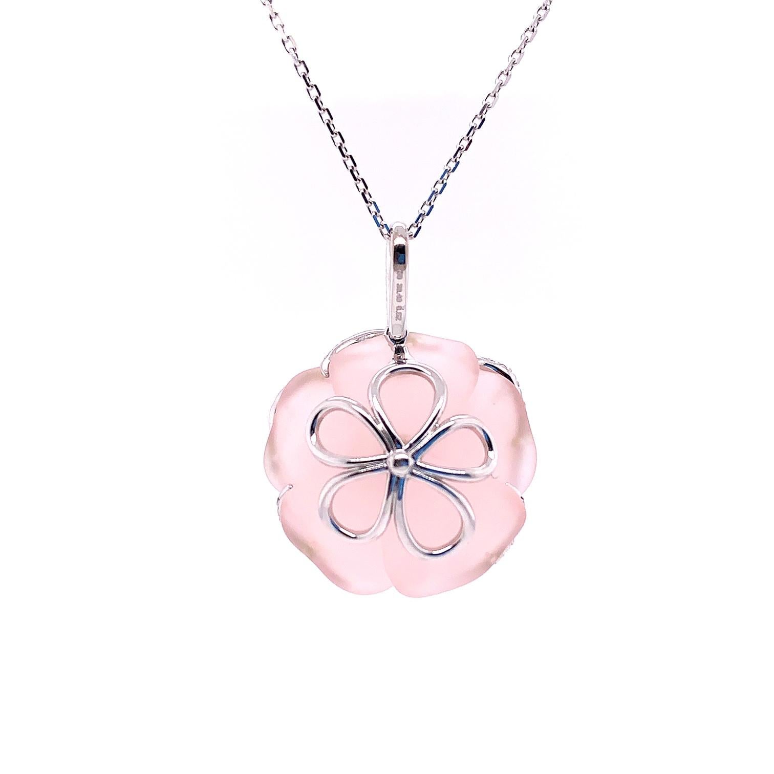 This beautiful pendant is comprised of hand carved rose quartz resembling a delicate Rose, weighing 39.49 carats, mounted with collection white diamonds totaling .52 carats.
Hand-crafted in 18 karat white gold.

Complete your look with a matching