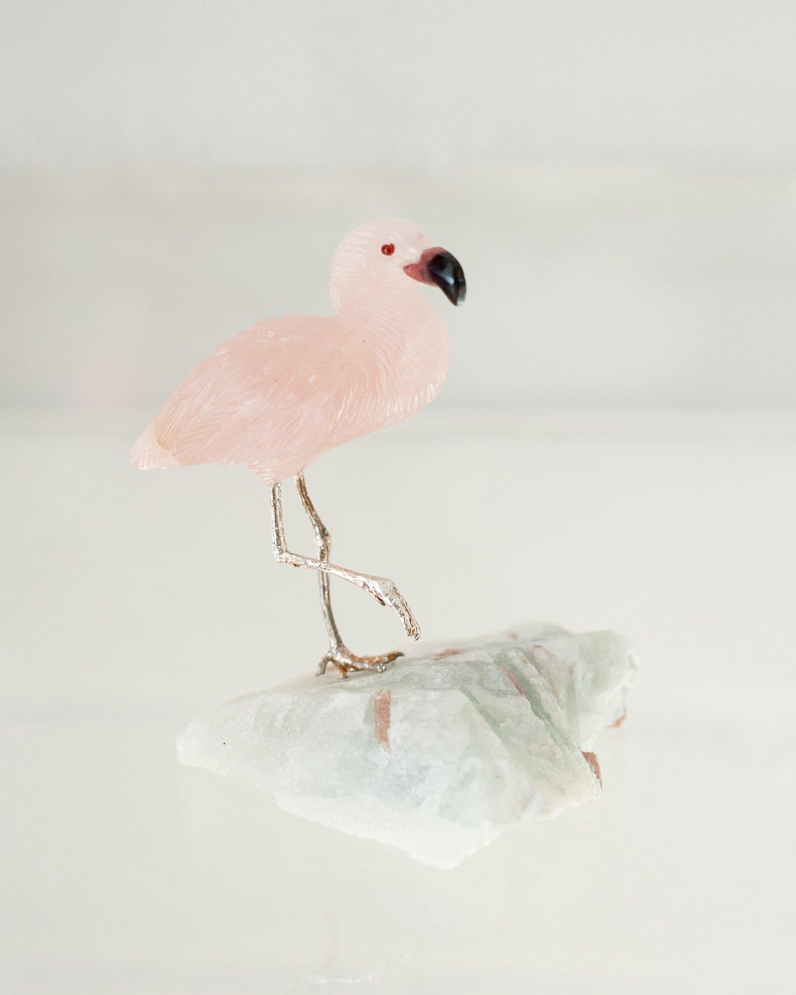 A beautiful hand carved semi precious rose quartz flamingo mounted on an aquamarine mineral specimen base. This exotic bird is a decorative combination of ornithology and geology.