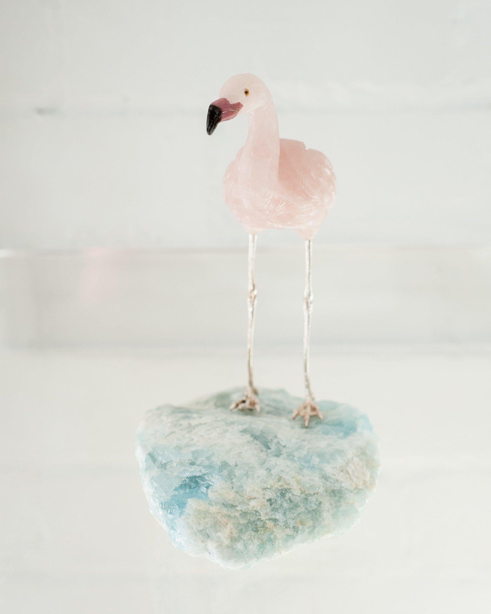 A beautiful hand carved semi precious rose quartz flamingo mounted on an aquamarine mineral specimen base. This exotic bird is a decorative combination of ornithology and geology.