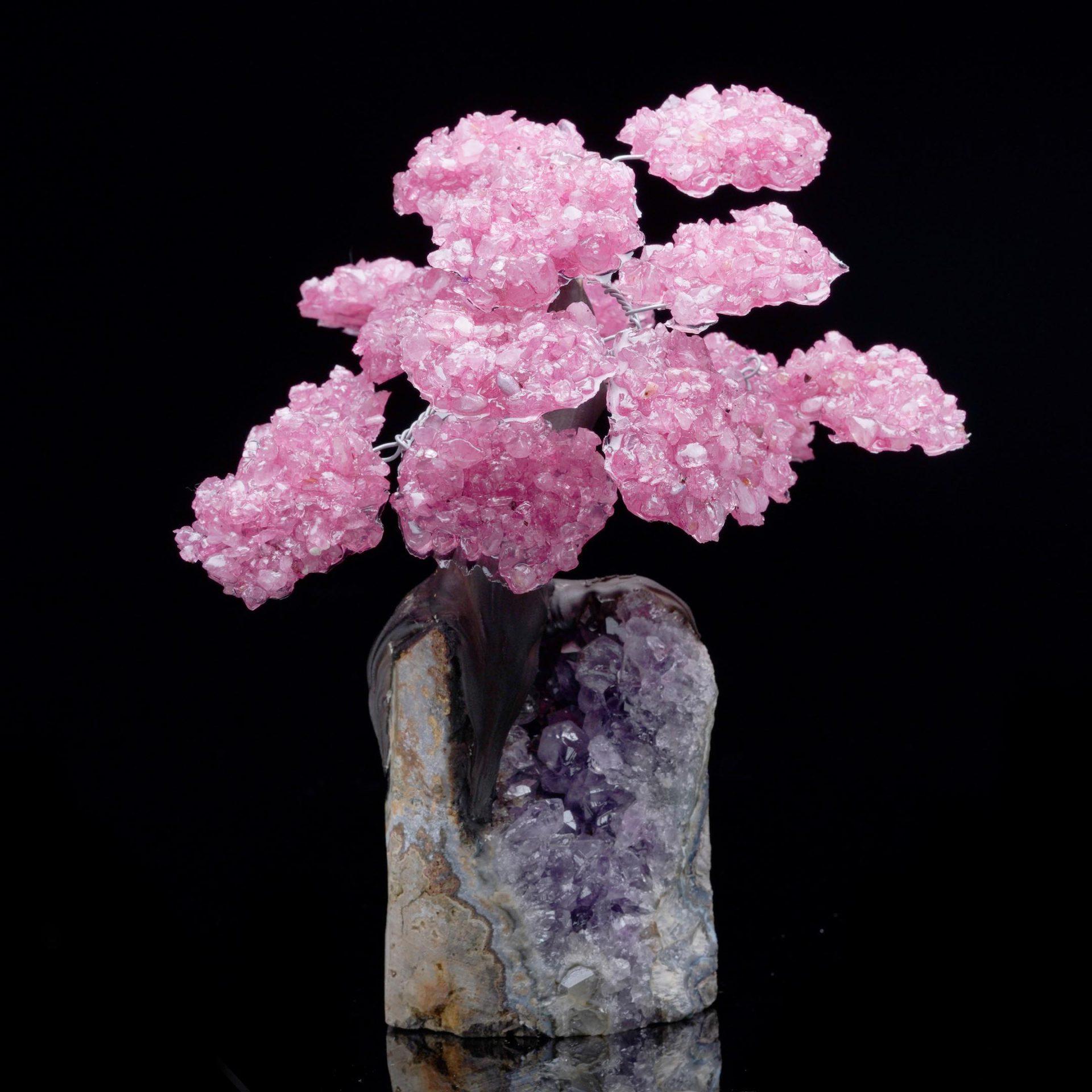 This exquisite handcrafted Rose Quartz gemstone tree on a raw Amethyst cluster base brings harmony, beauty, and a touch of natural elegance to any space. Each “branch” is adorned with vibrant pink polished Rose Quartz crystals that shimmer with