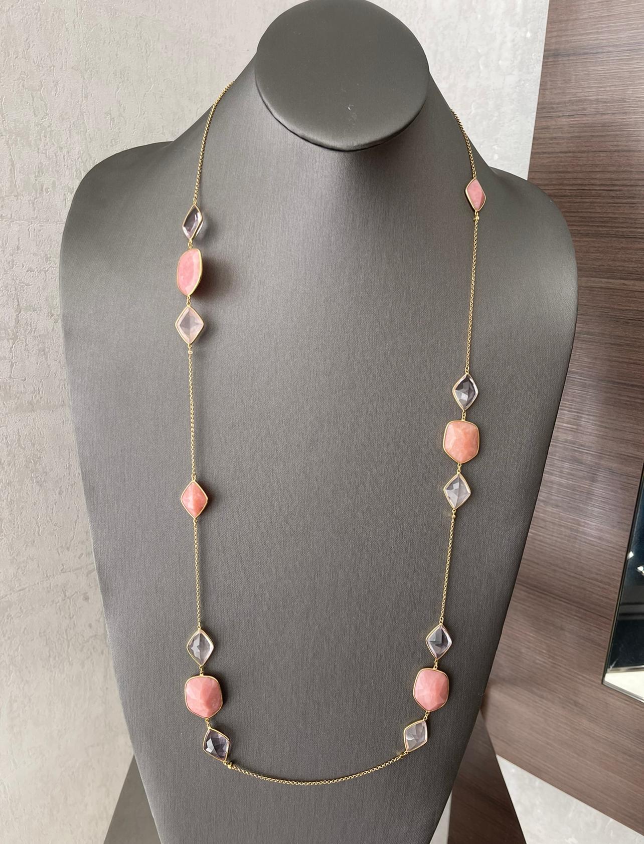 Rose Quartz Necklace in 18K Yellow Gold. The necklace features stations of rose quartz that are bezel set. 
39