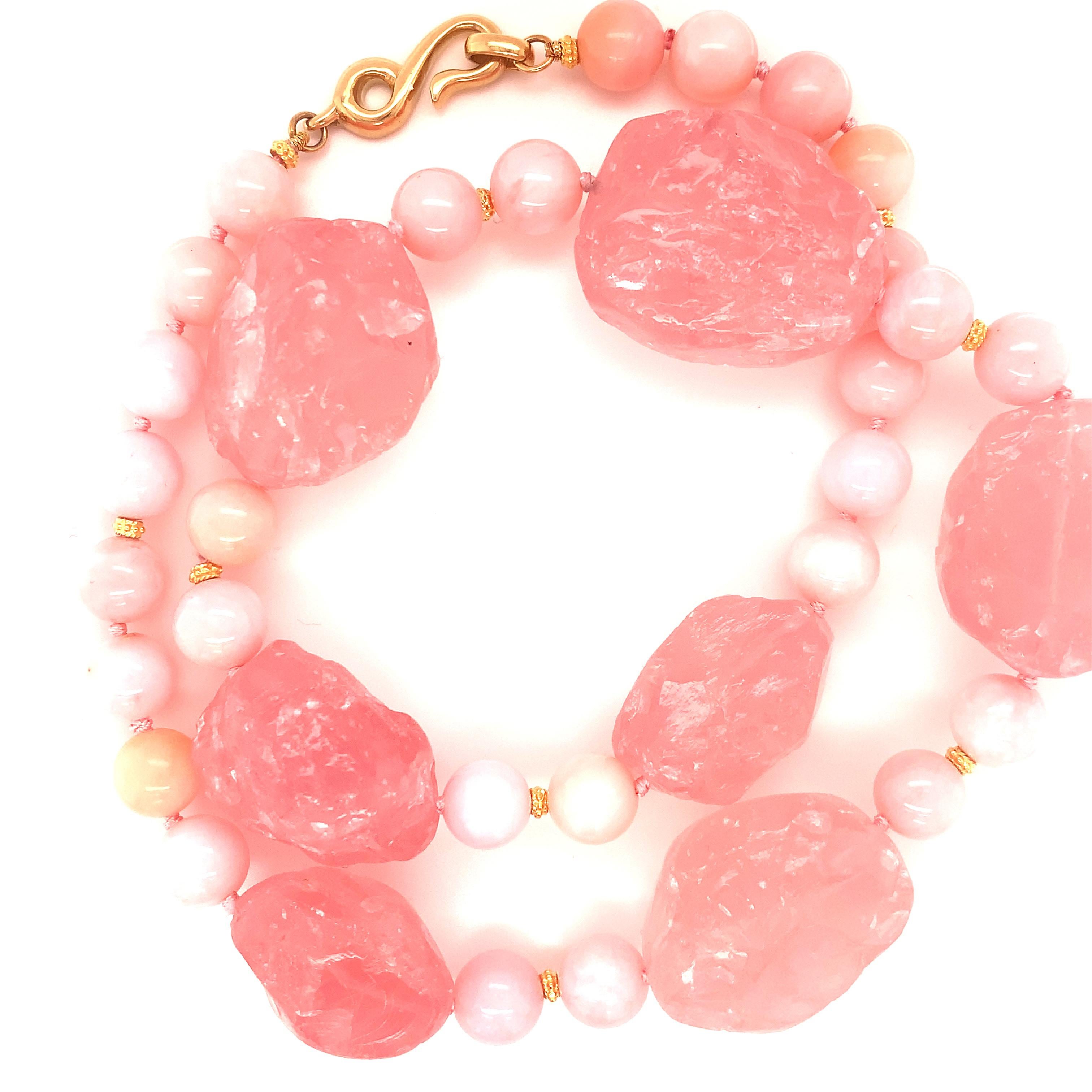 For someone who loves pink and is ready to make a statement, this rose quartz nugget and pink opal necklace is for you! 7 large, crystalline, tumbled rose quartz nuggets with gorgeous bubblegum pink color have been strung on lovely pink silk in this