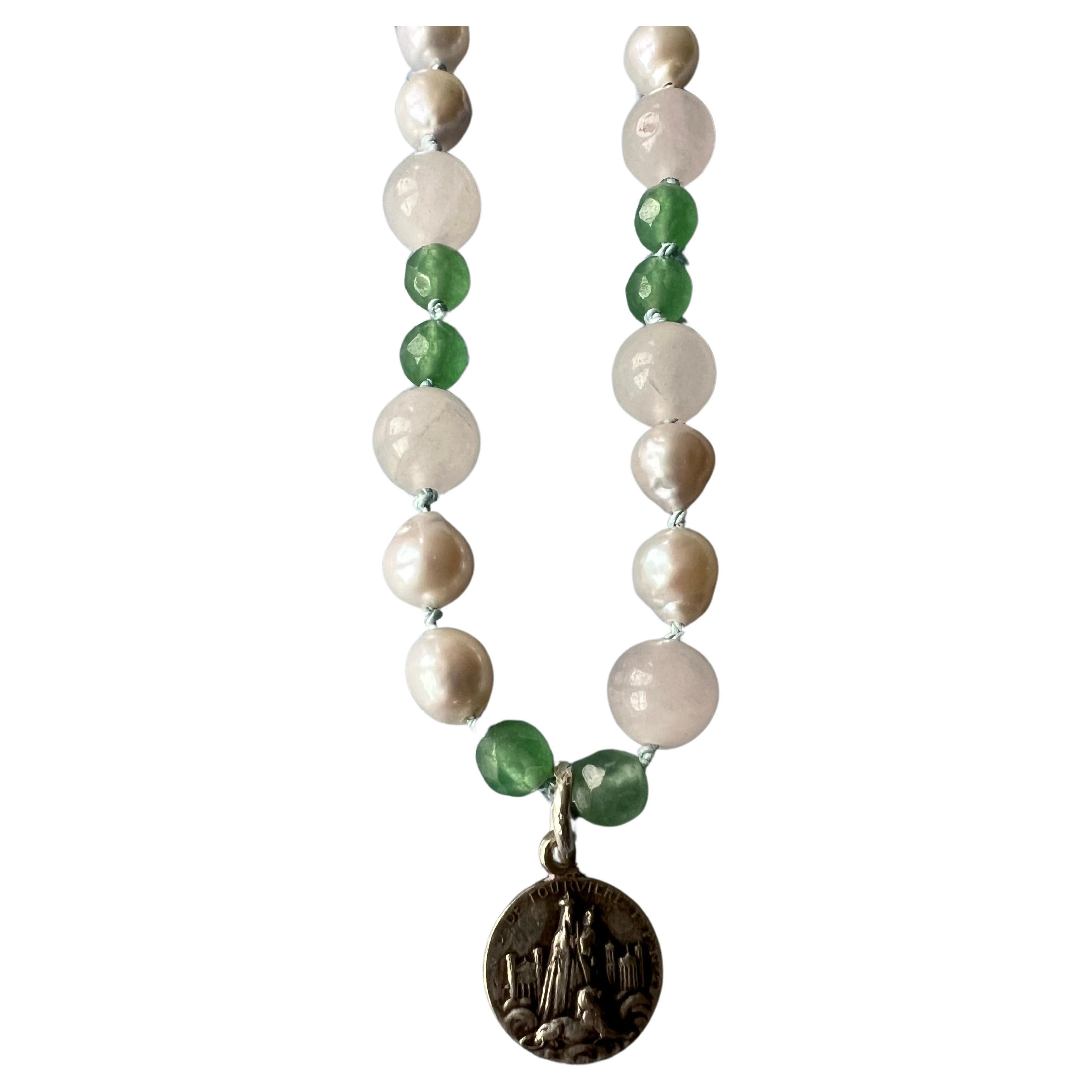 Rose Quartz, White Pearl and Green Chrysoprase Bead Necklace French Vintage Silver Tone Medal J Dauphin
Gold Filled Clasp

37 Cm

This mini antique or vintage medal  is a representation of the Virgin Mary, emblematic of her role as both a mother and