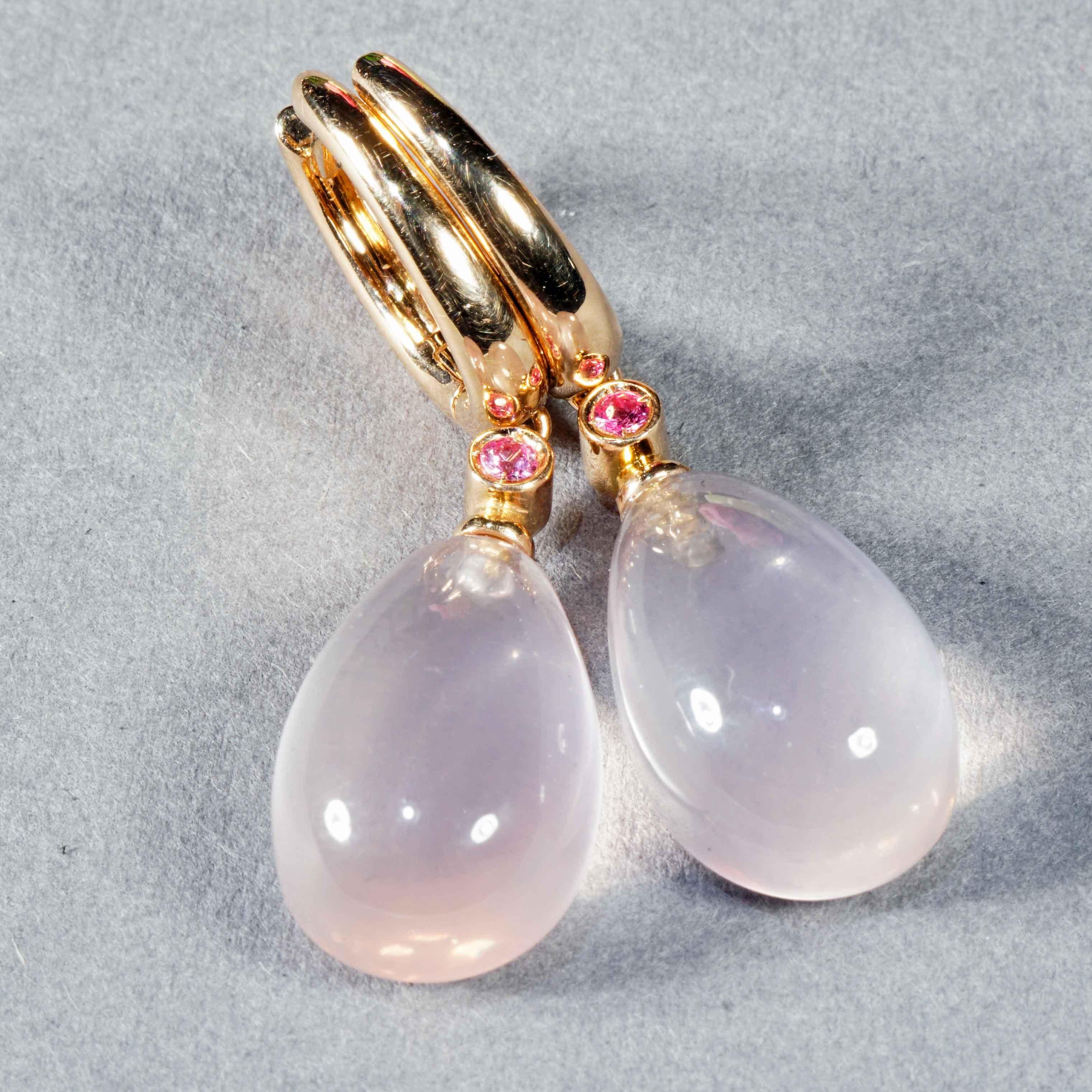 High-quality earrings made in a traditional Italian goldsmith in Valenza, modern earrings design, each with a teardrop-cut, transparent rose quartz cabochon totaling approx. 20.33 ct, each connected to a pink sapphire in a chaton setting, firmly