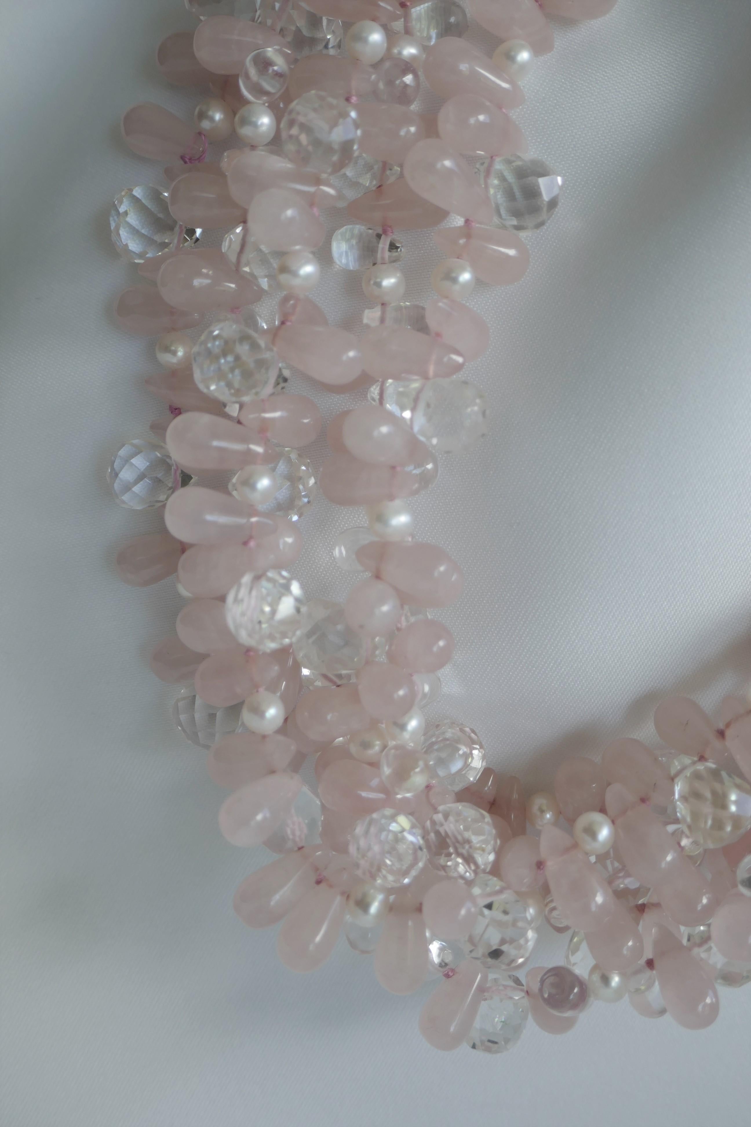 This multi strand (5 strand) rose quartz, rock crystal and white cultured fresh pearl necklace is a statement piece that looks beautiful on. The necklace given the luminosity of the faceted rock crystal and rock crystal briolettes bring this