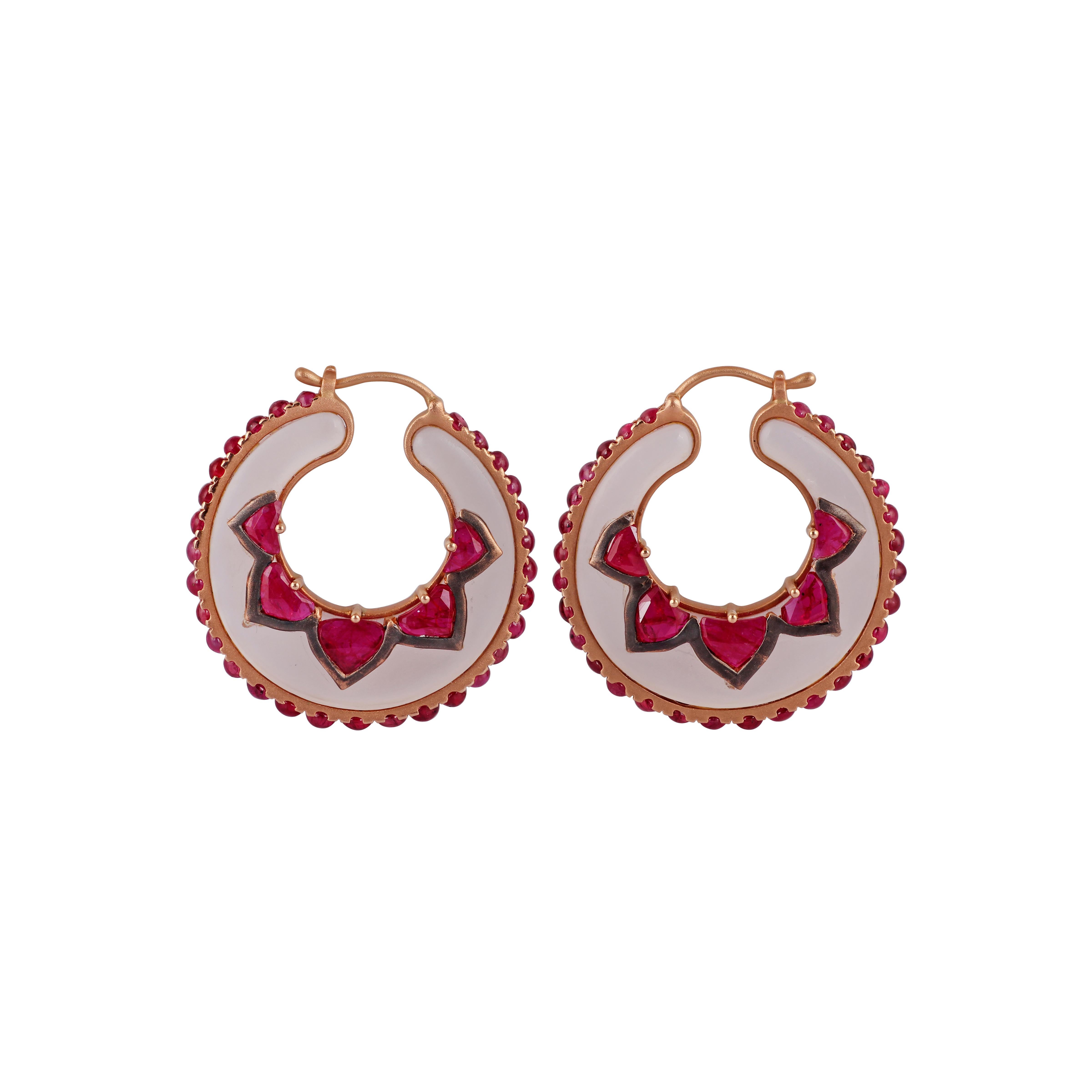 These are an exclusive & designer hoop style of earrings studded in 18k rose gold features rose quartz weight 32.10 carats & ruby weight 9.22 carats, these earrings are entirely made of 18k rose gold weight 8.76 grams, these earrings looks very