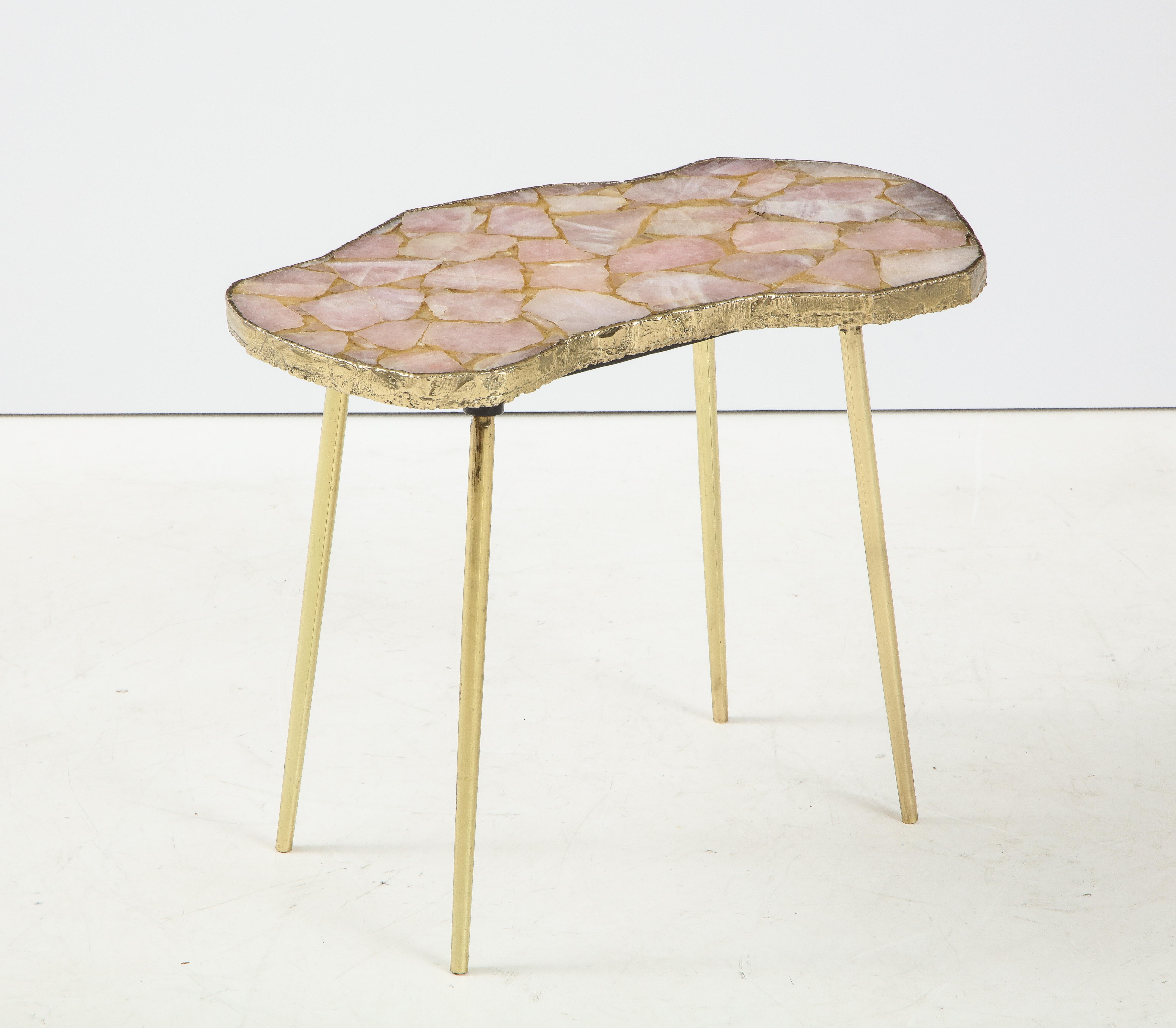 Organic modern sidetable with rose quartz specimen top with a gilded rough hewn edge and brass legs.
