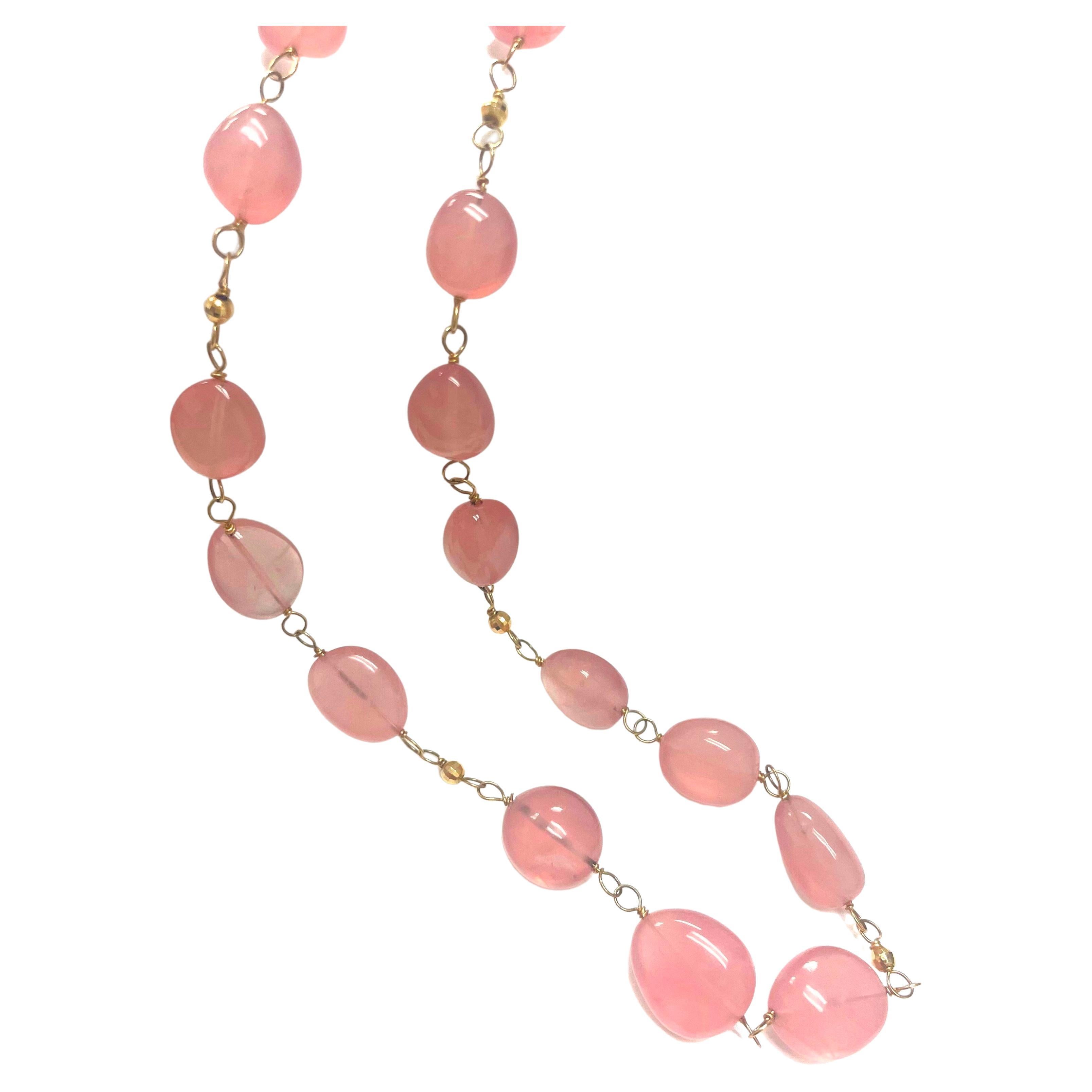 Description
Feminine, beautifully shaped smooth nuggets in a gorgeous uniform color of semi-opaque rose quartz and accented with faceted 3mm 14k yellow gold balls. The necklace is handmade with 14k yellow gold links and can be worn long or short