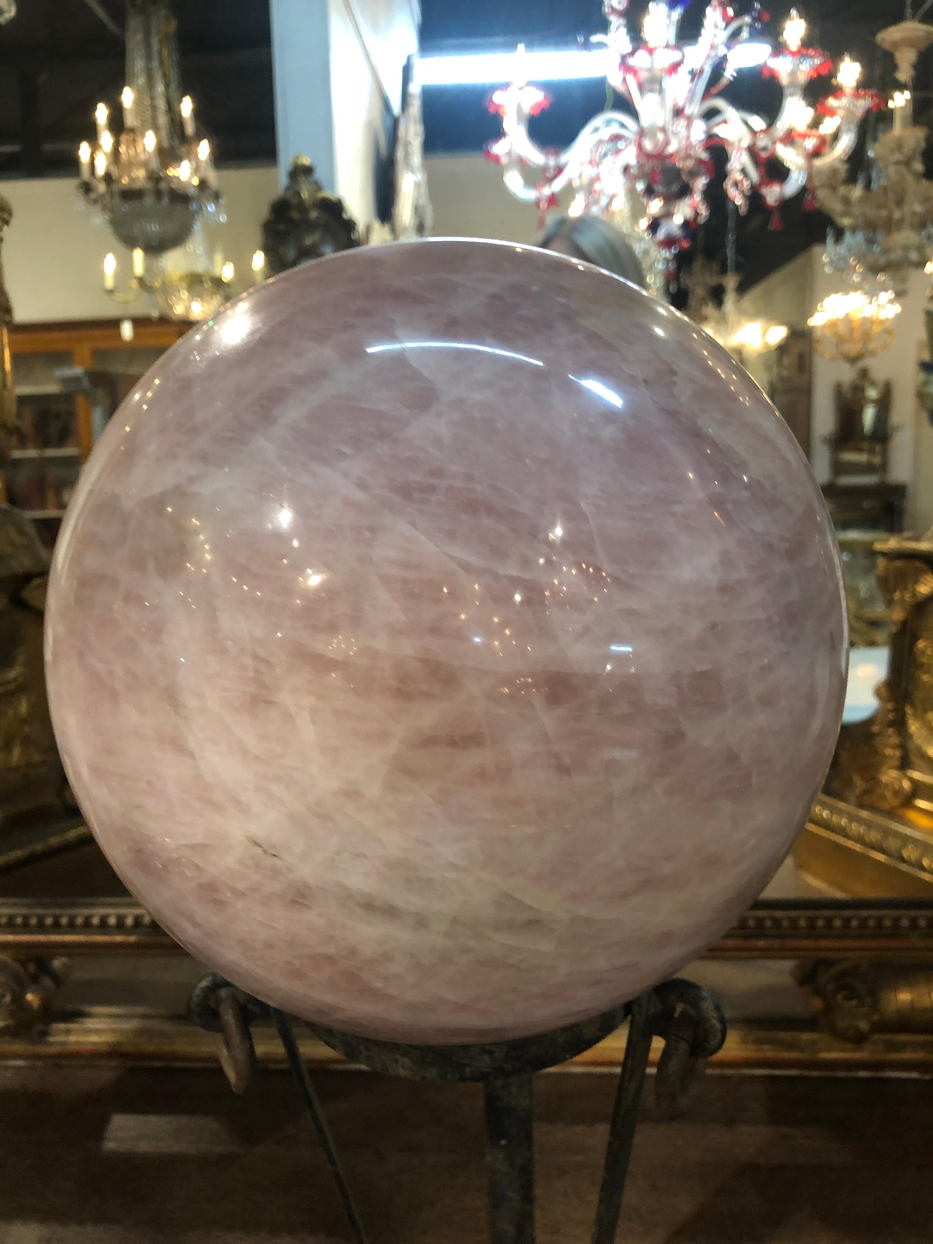 Very impressive polished rose quartz sphere on an iron base. A beautiful accessory!

   