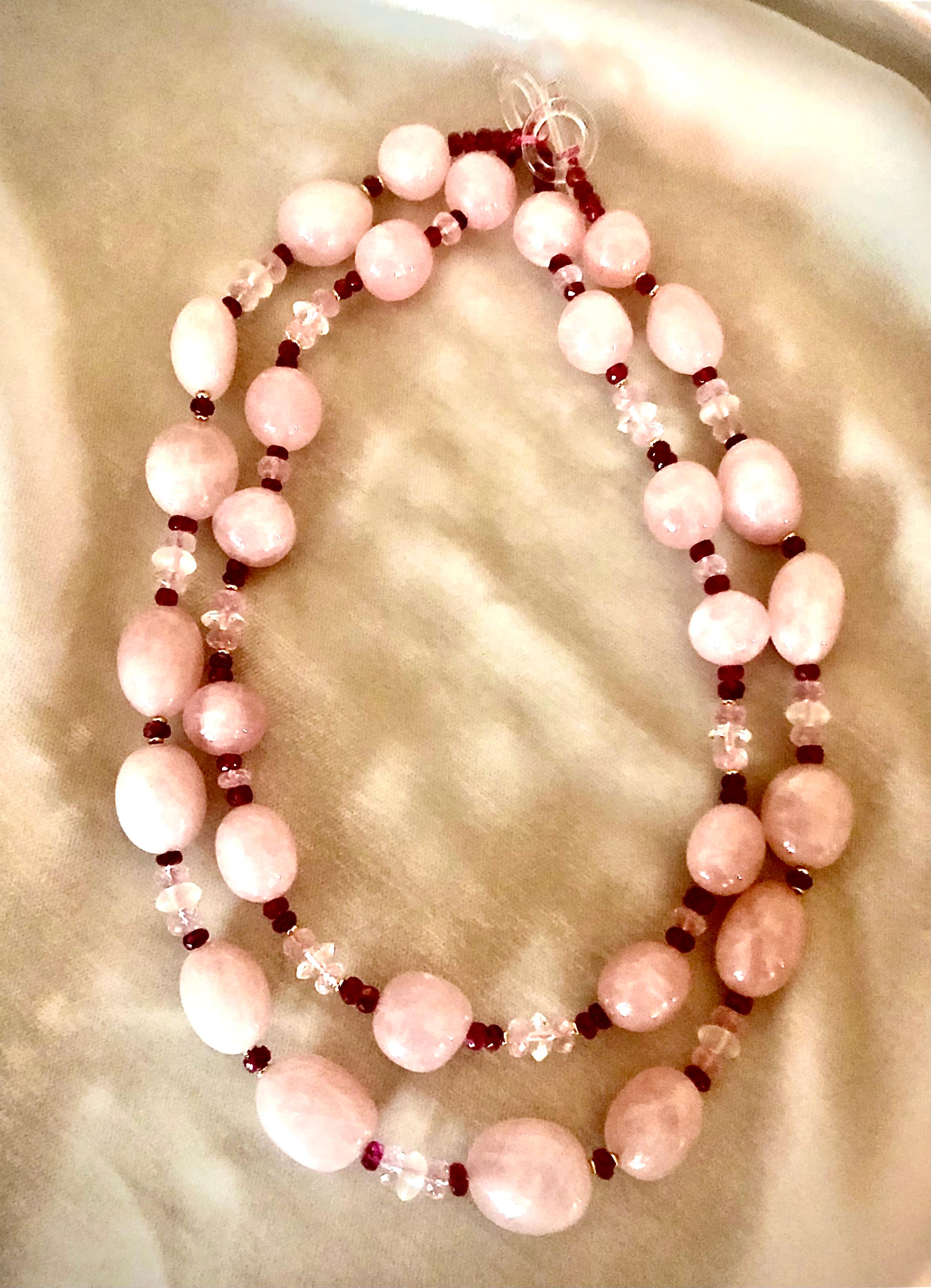 Pretty pink but still quite sophisticated and chic necklace. The major element of this pair of necklaces is beautiful very slightly peach sugary pink translucent rose quartz large beads. Beads range in size from approximately 20mm to 8.5mm

Flanking