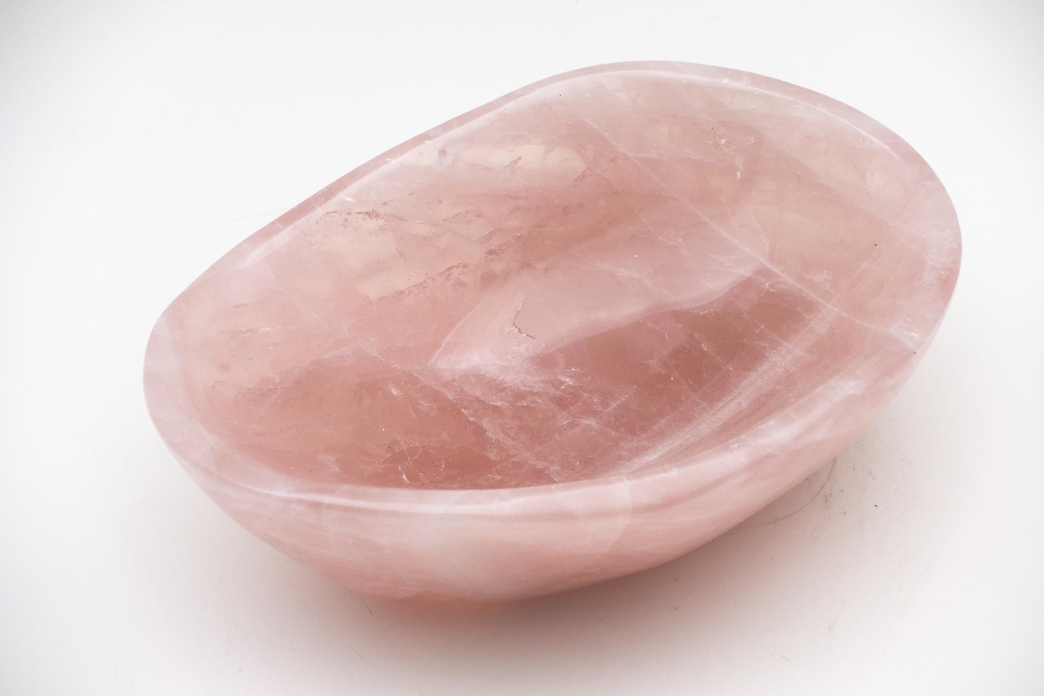 Hand-carved rose quartz vide-poche or coin tray from Madagascar. The vide-poche (empty-pocket in French) is a small bowl or container kept in a convenient location to empty your pockets into when you walk through the door.