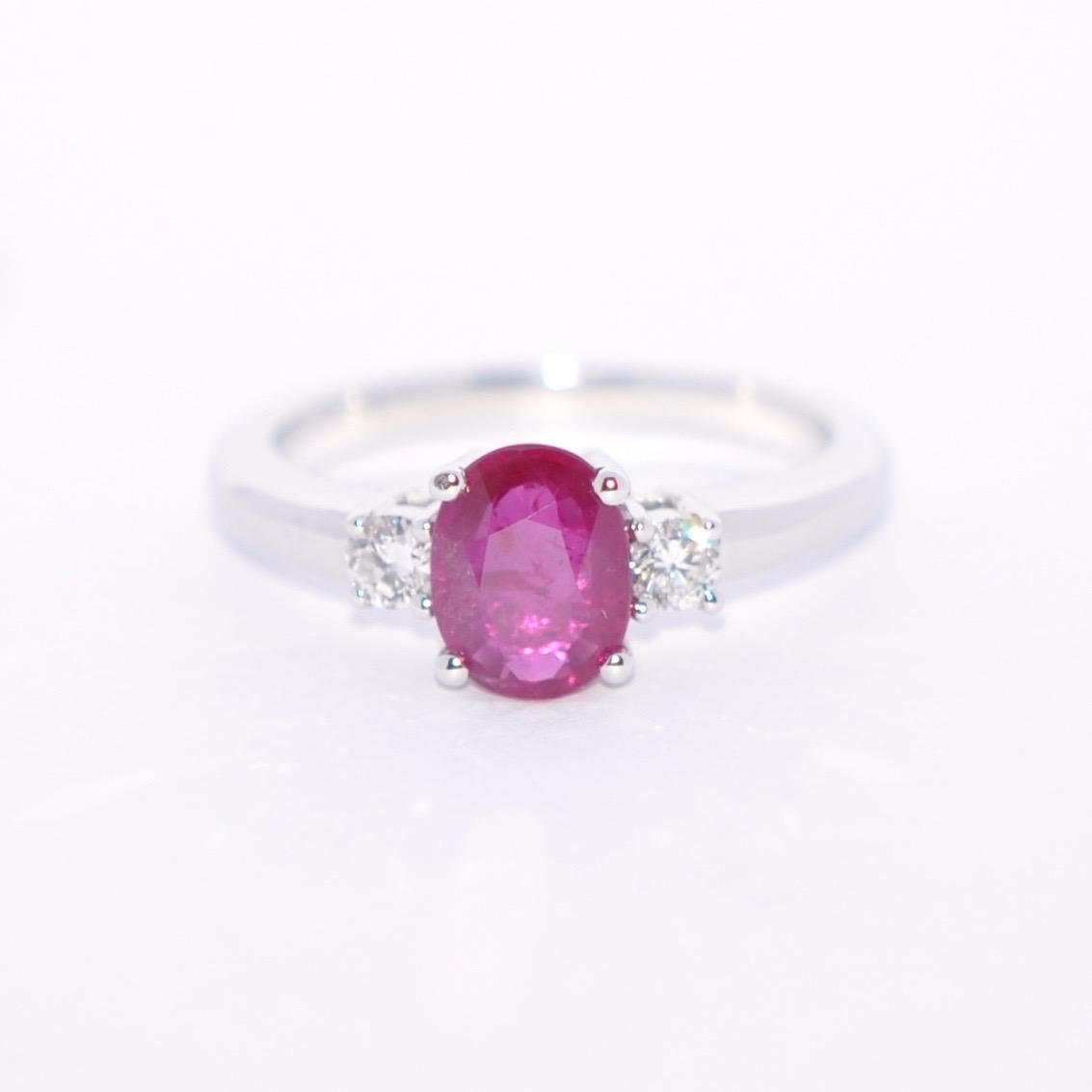 Discover this Rose Ruby and White Diamond on White Gold 18 Karat Engagement Ring.
Oval Rose Ruby 1.31 Karat
2 Round White Diamond 0.20 Karat Color G 
White Gold 18 Karat 
French Size 53 
US Size 6.5