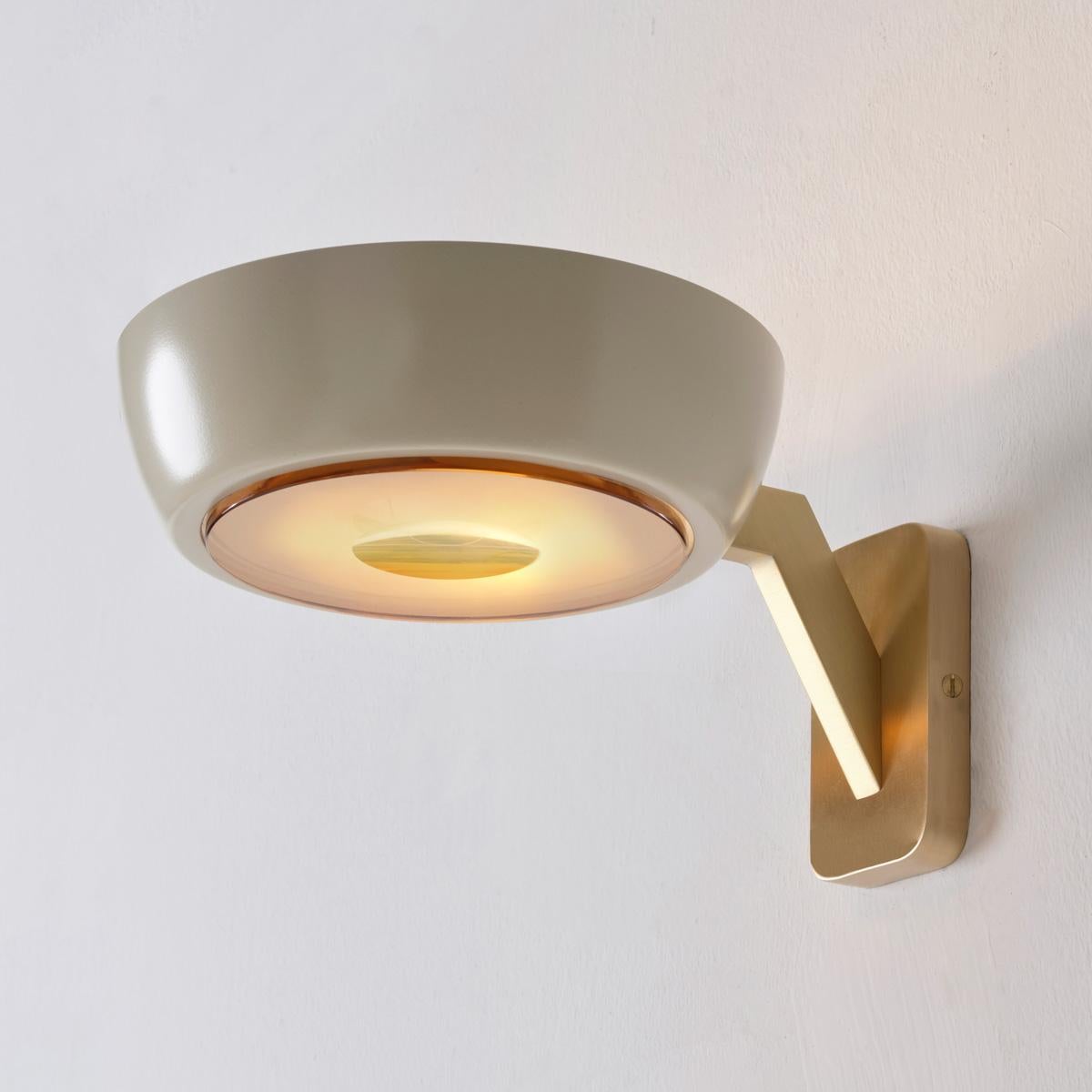 The Rose Single wall light featuring a large shade on an angled brass frame, lends itself to customization with the ability to change the shade color, glass diffuser and frame finish. See the matching Rose ceiling lights and Rose Double wall light